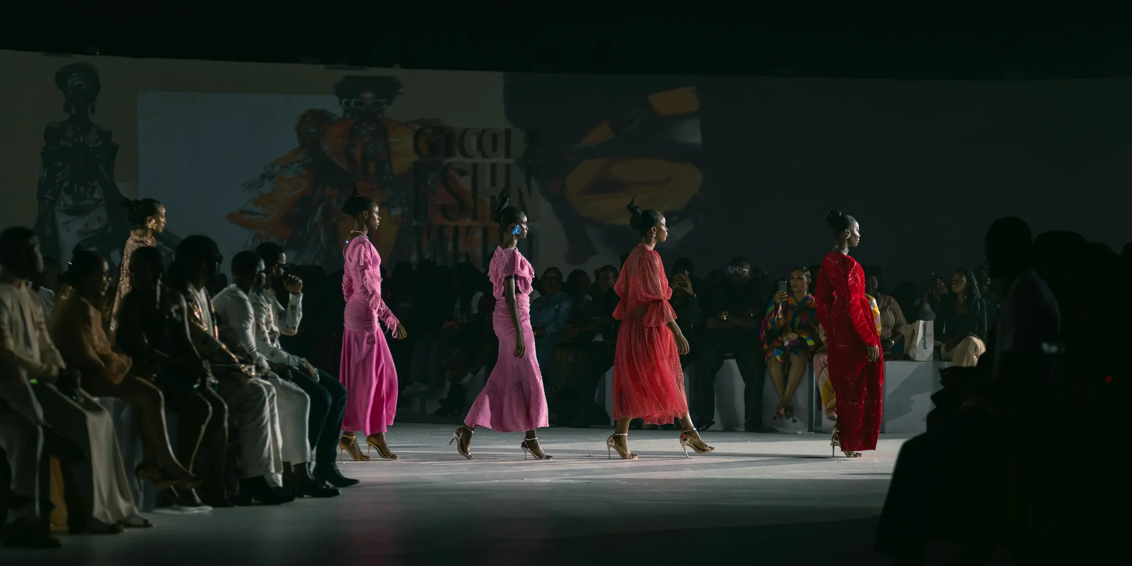 A group of women walking down a runway