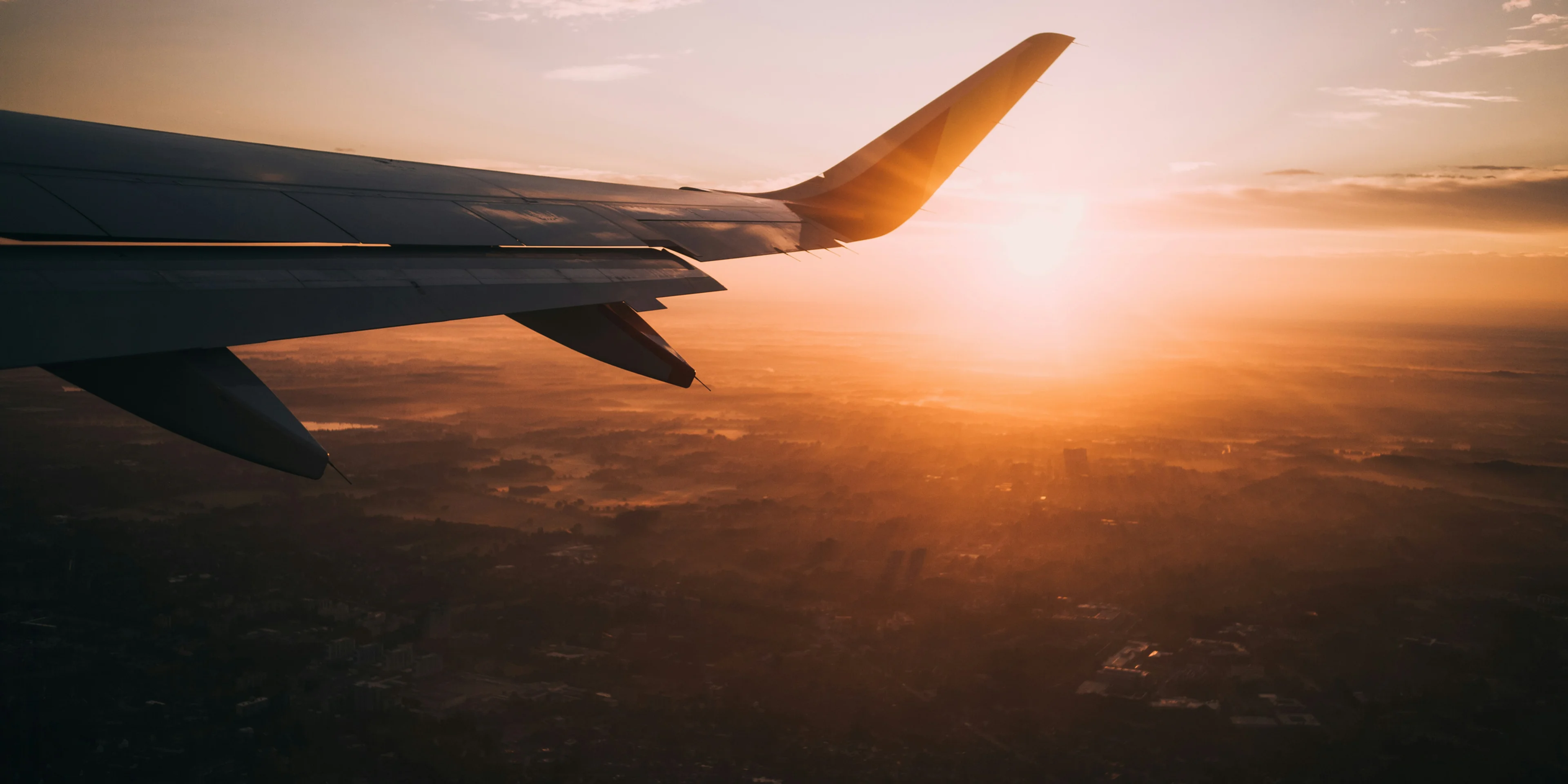airplane on sky during golden hour.