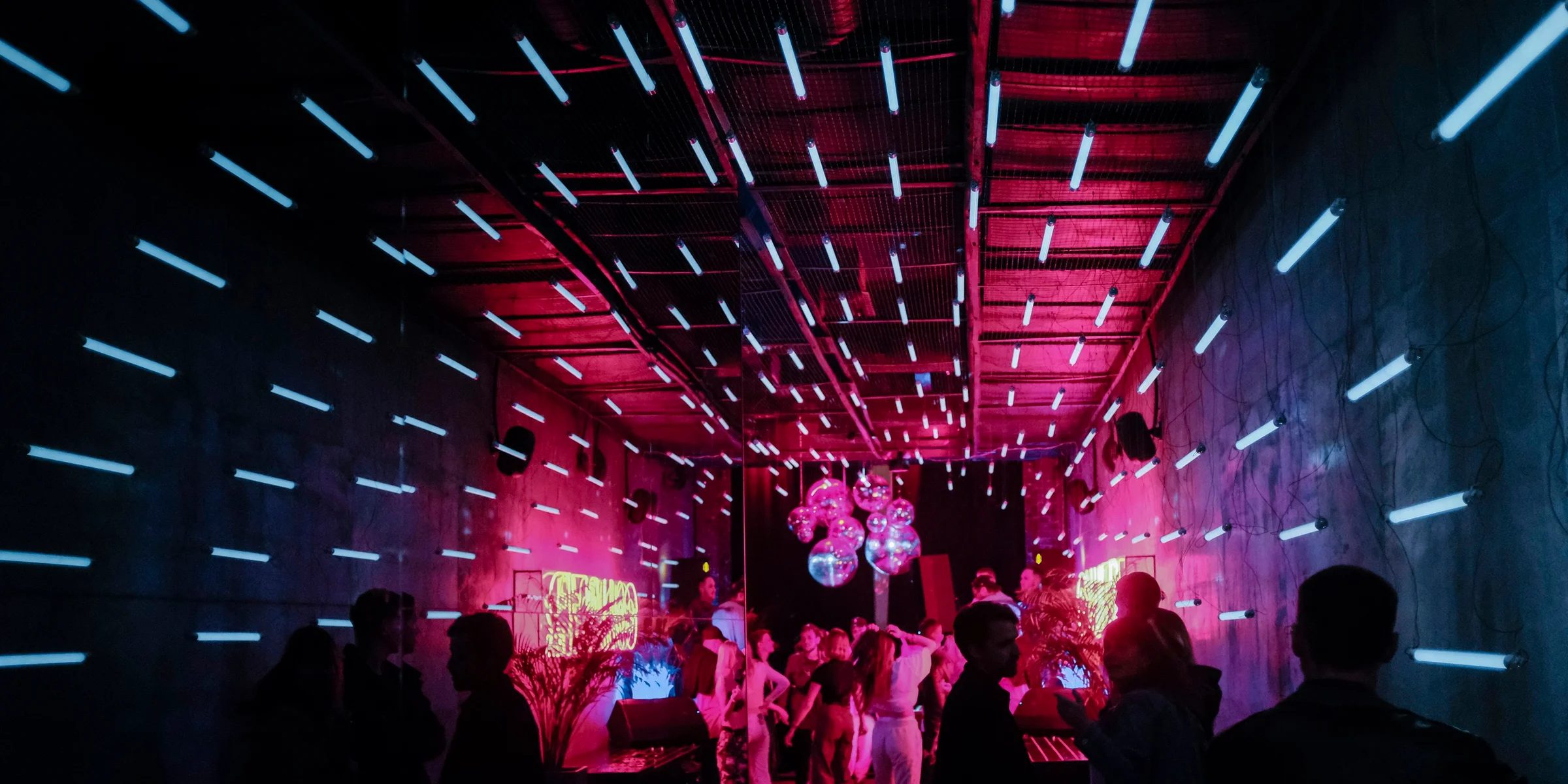 a group of people standing around in a room.