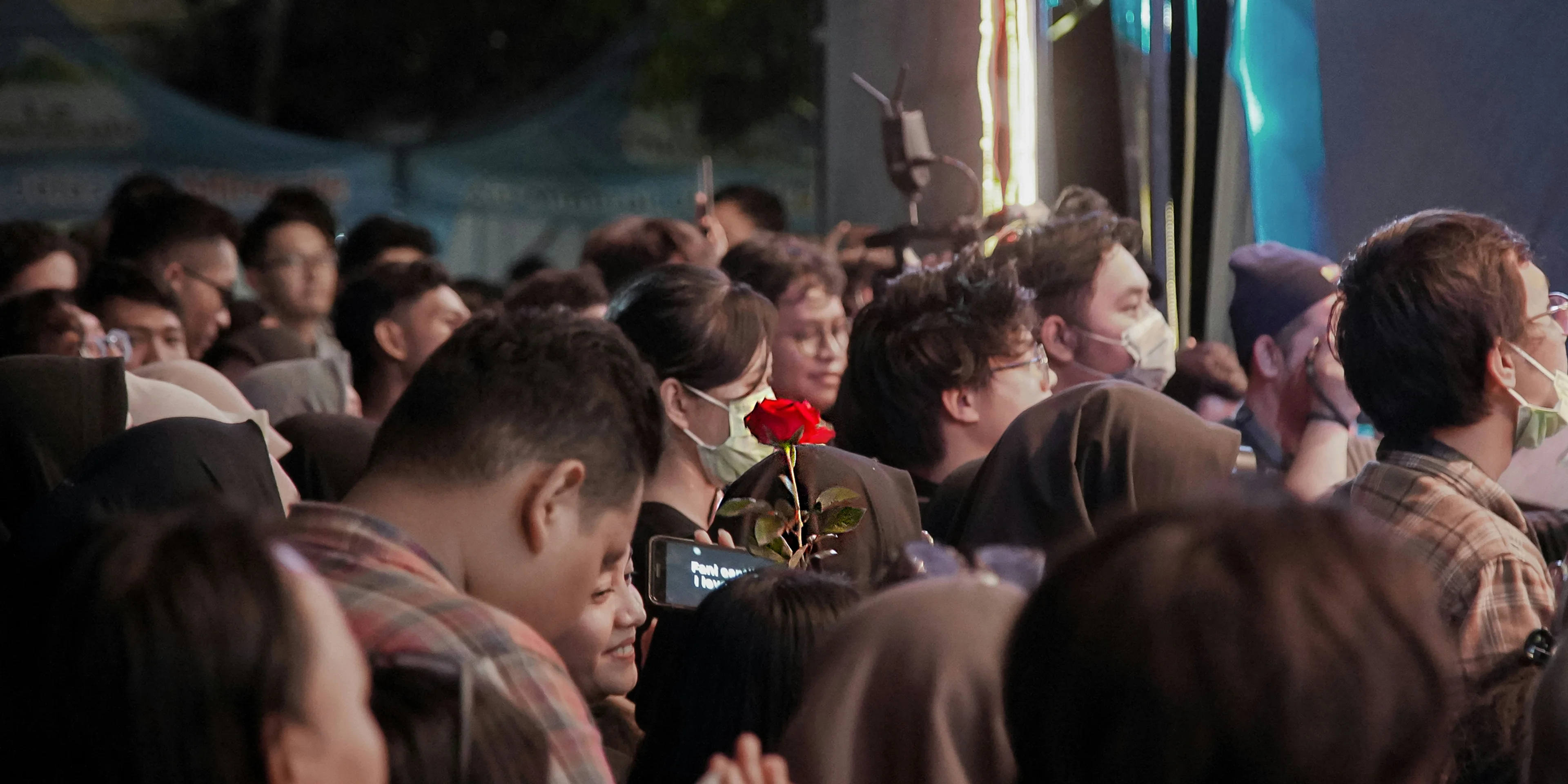 people gathering in a concert during night time.