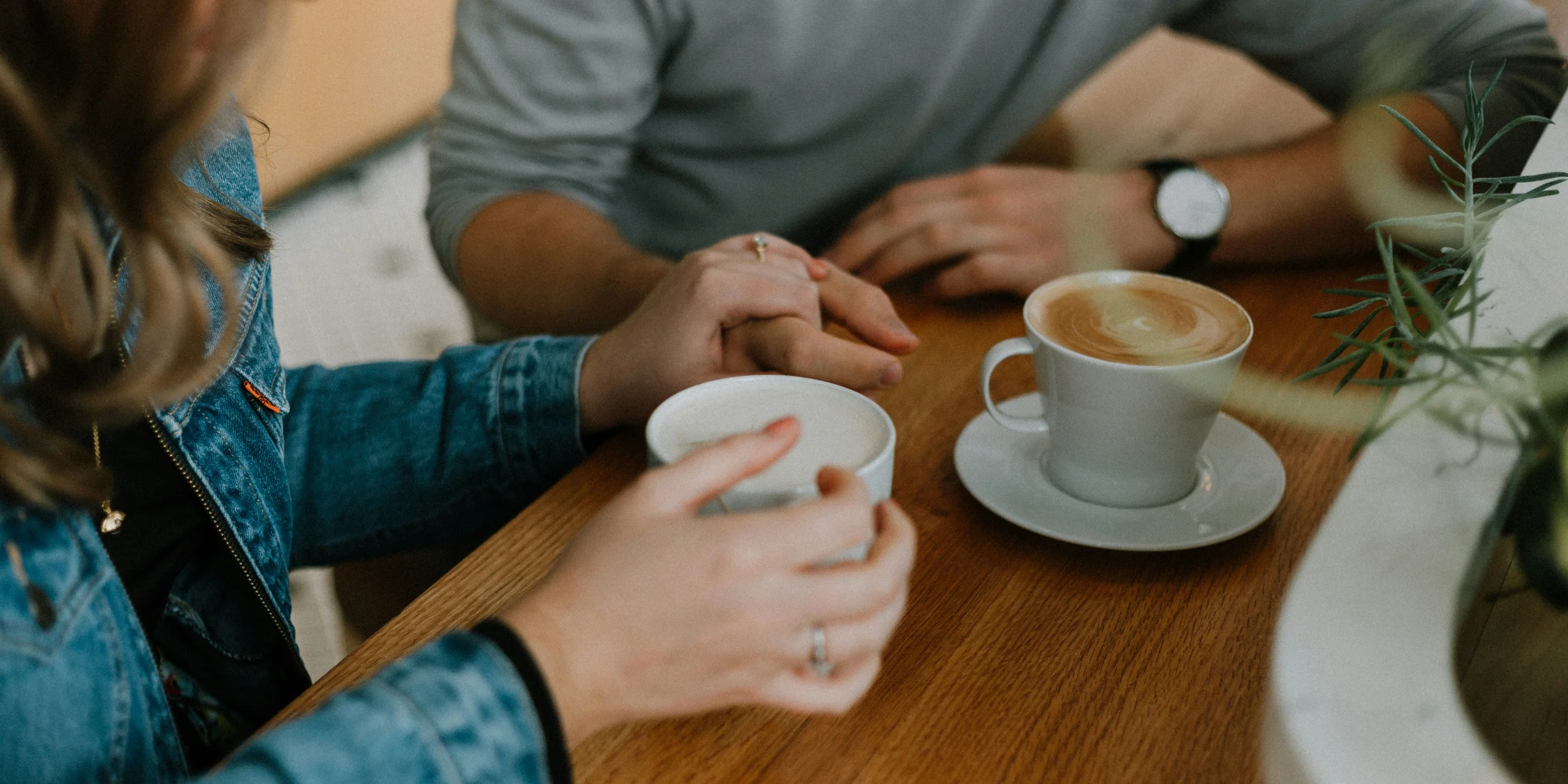 two mugs with coffee on table