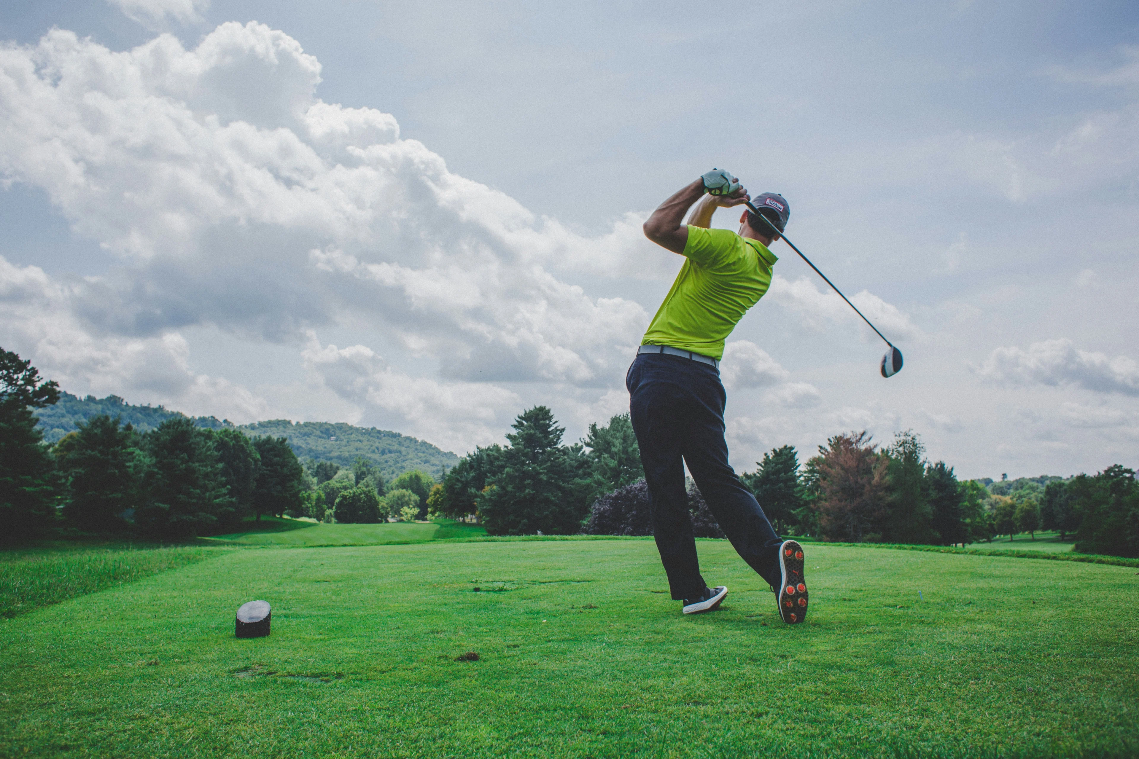 Happy person golfing