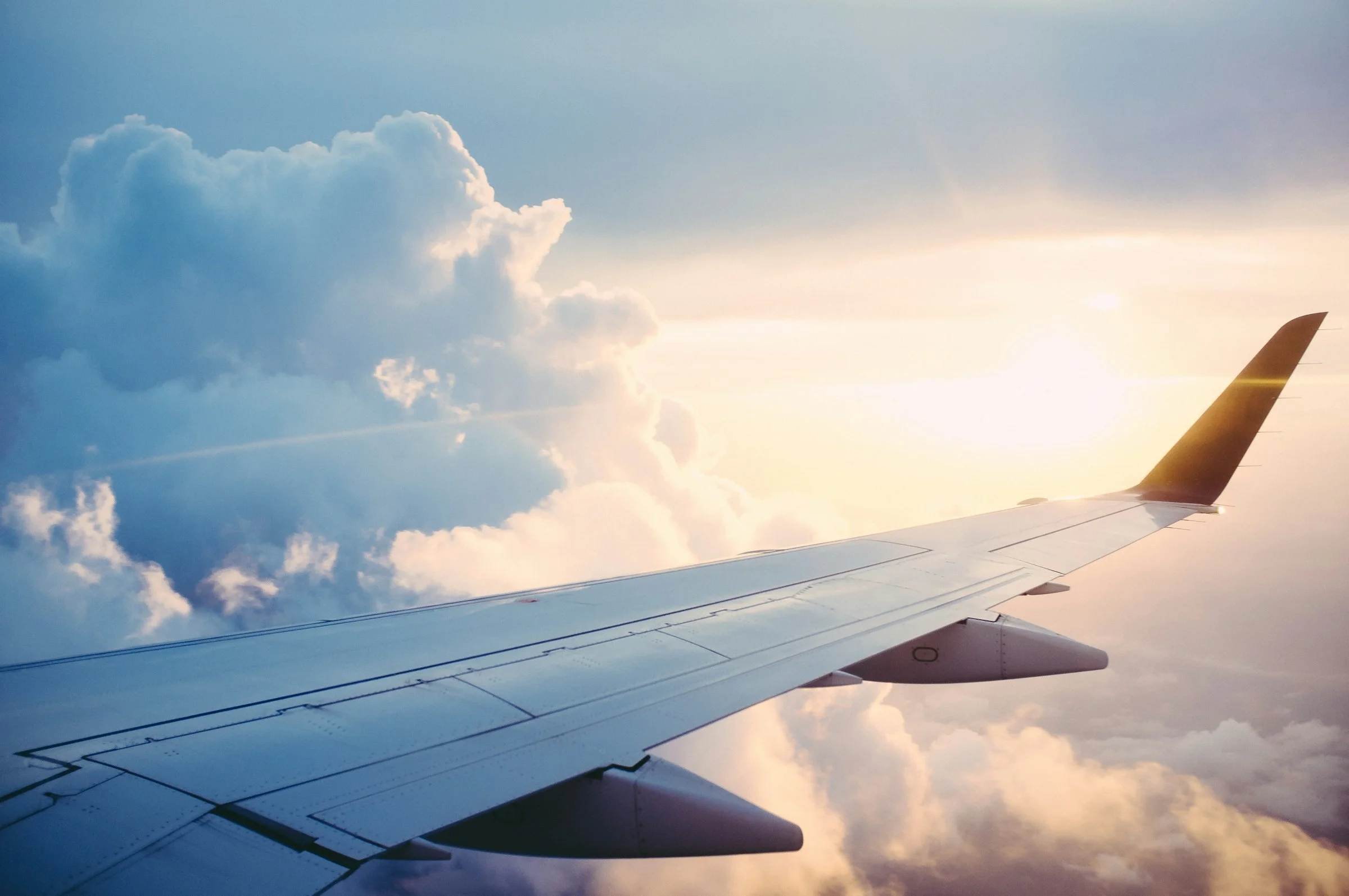 Airplane wing above mountains