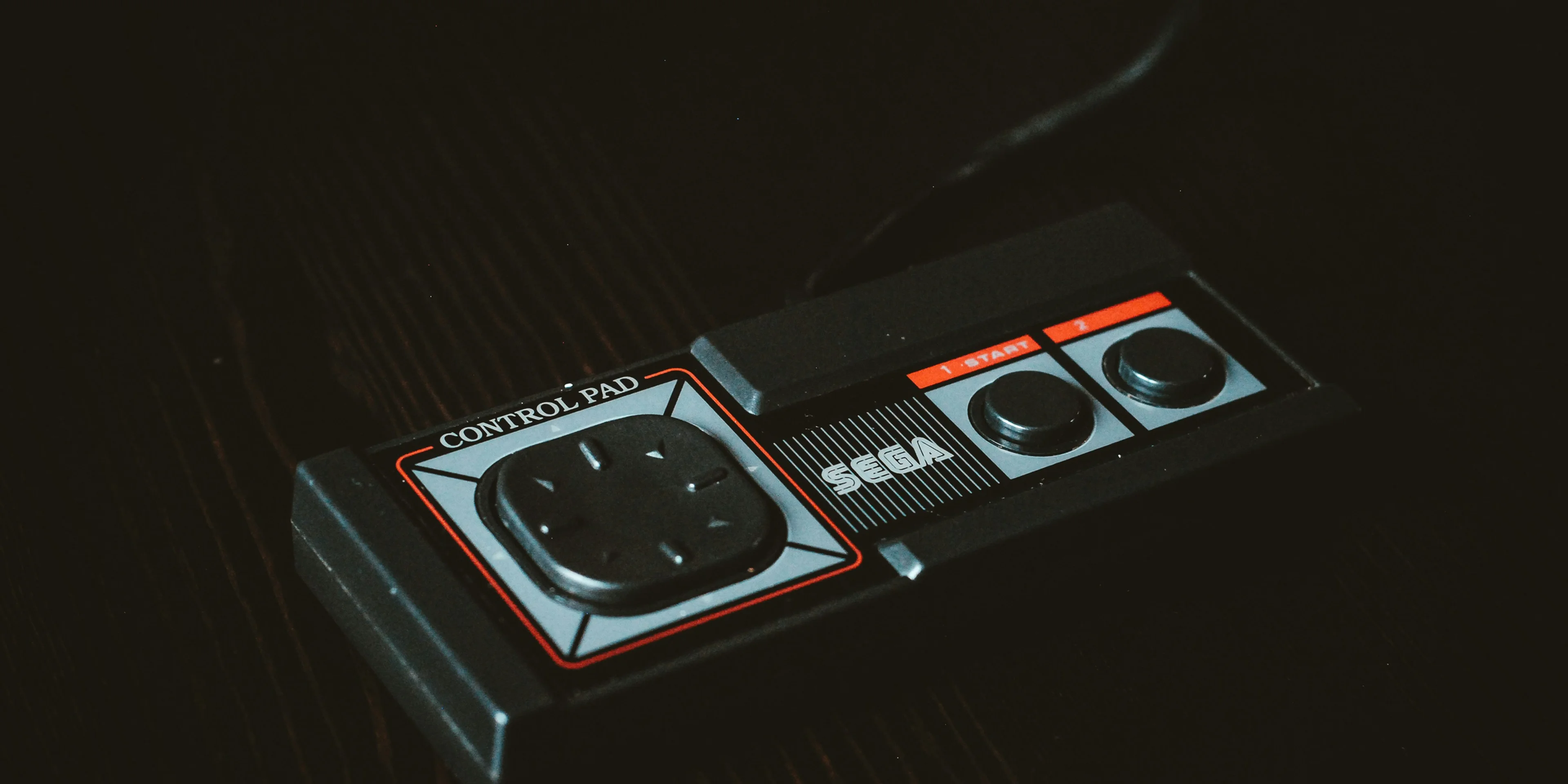 black Sega control pad.