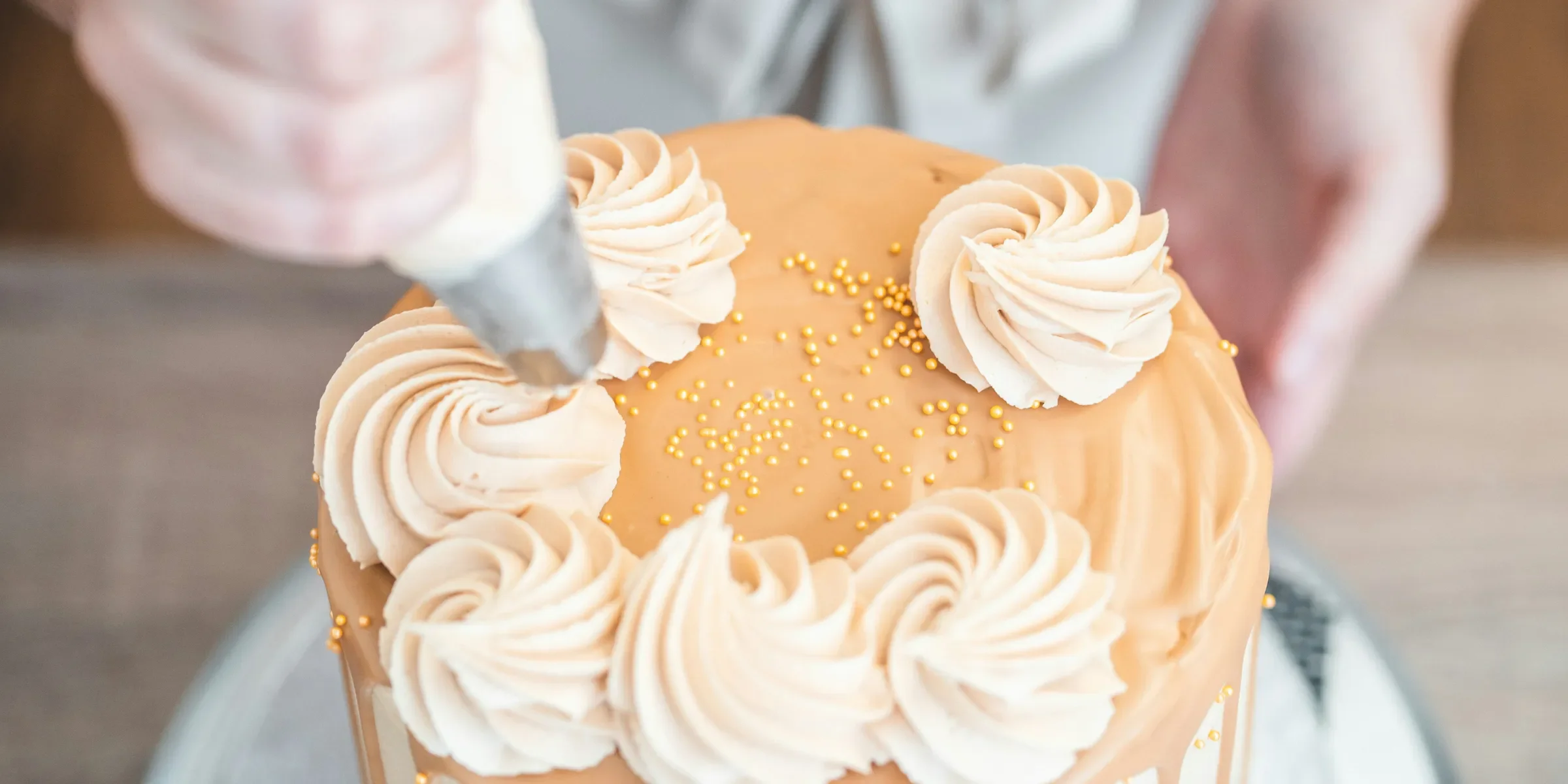 a person cutting a cake with a knife