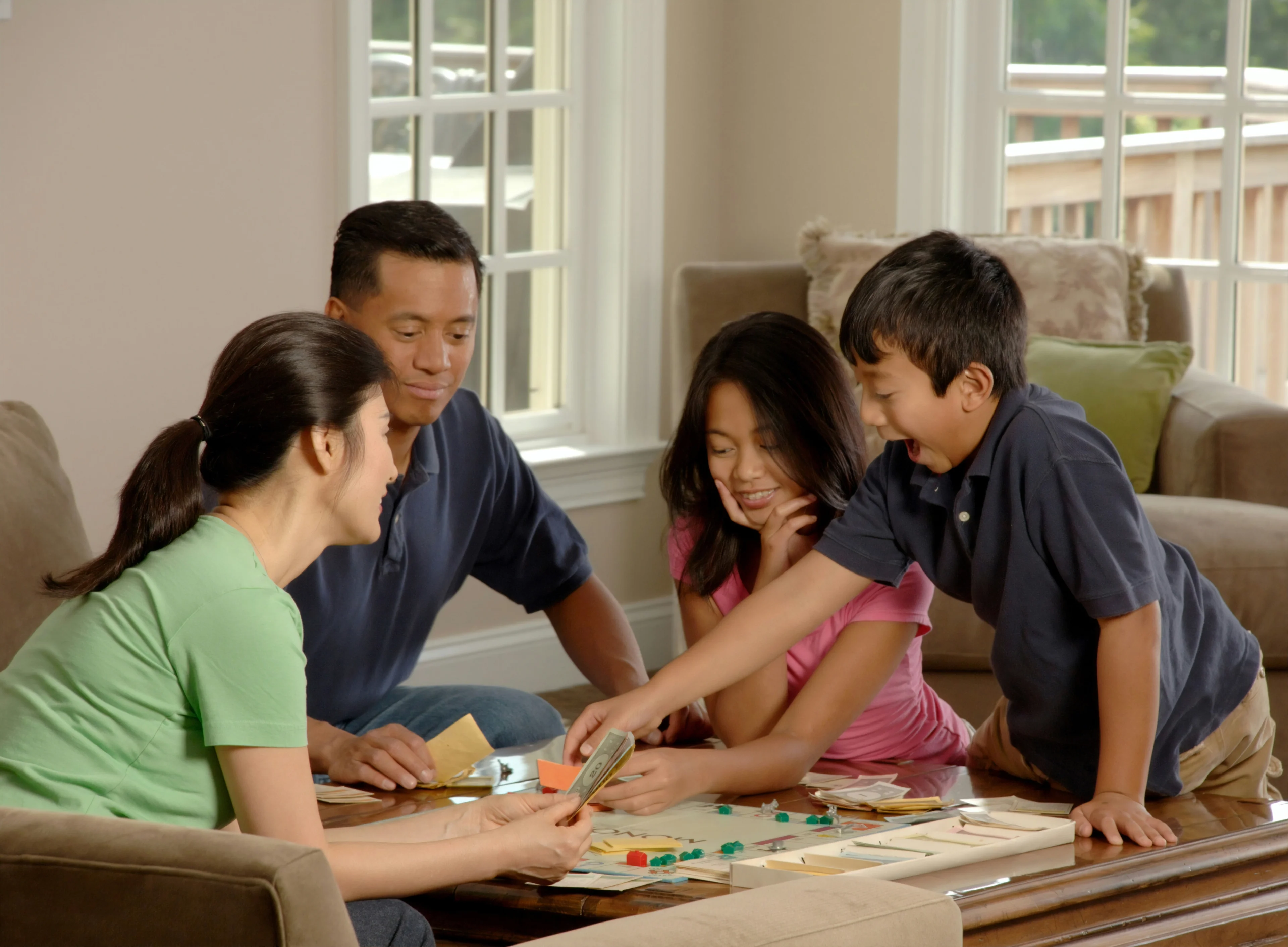happy family playing board game
