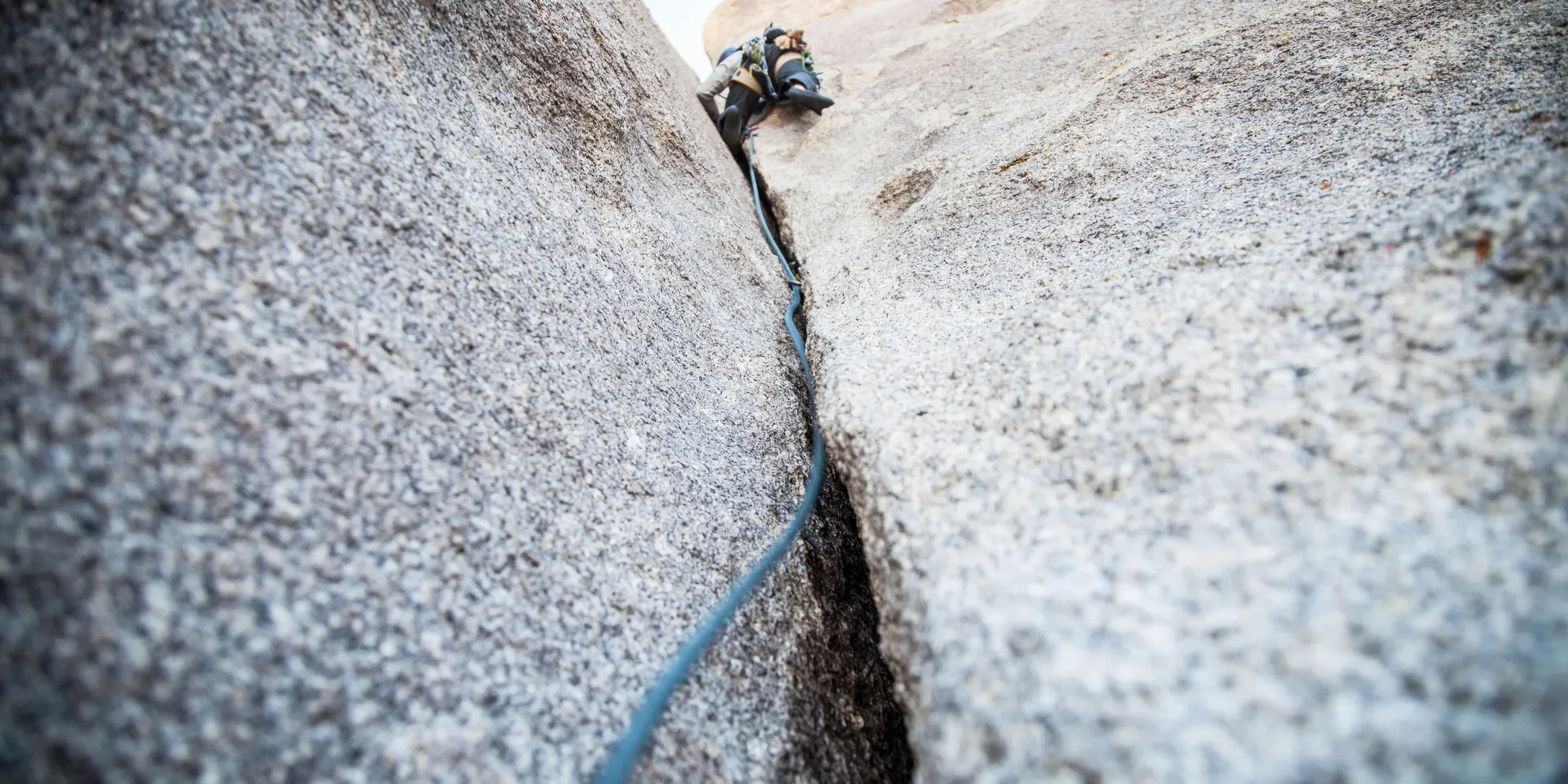 person rock climbing