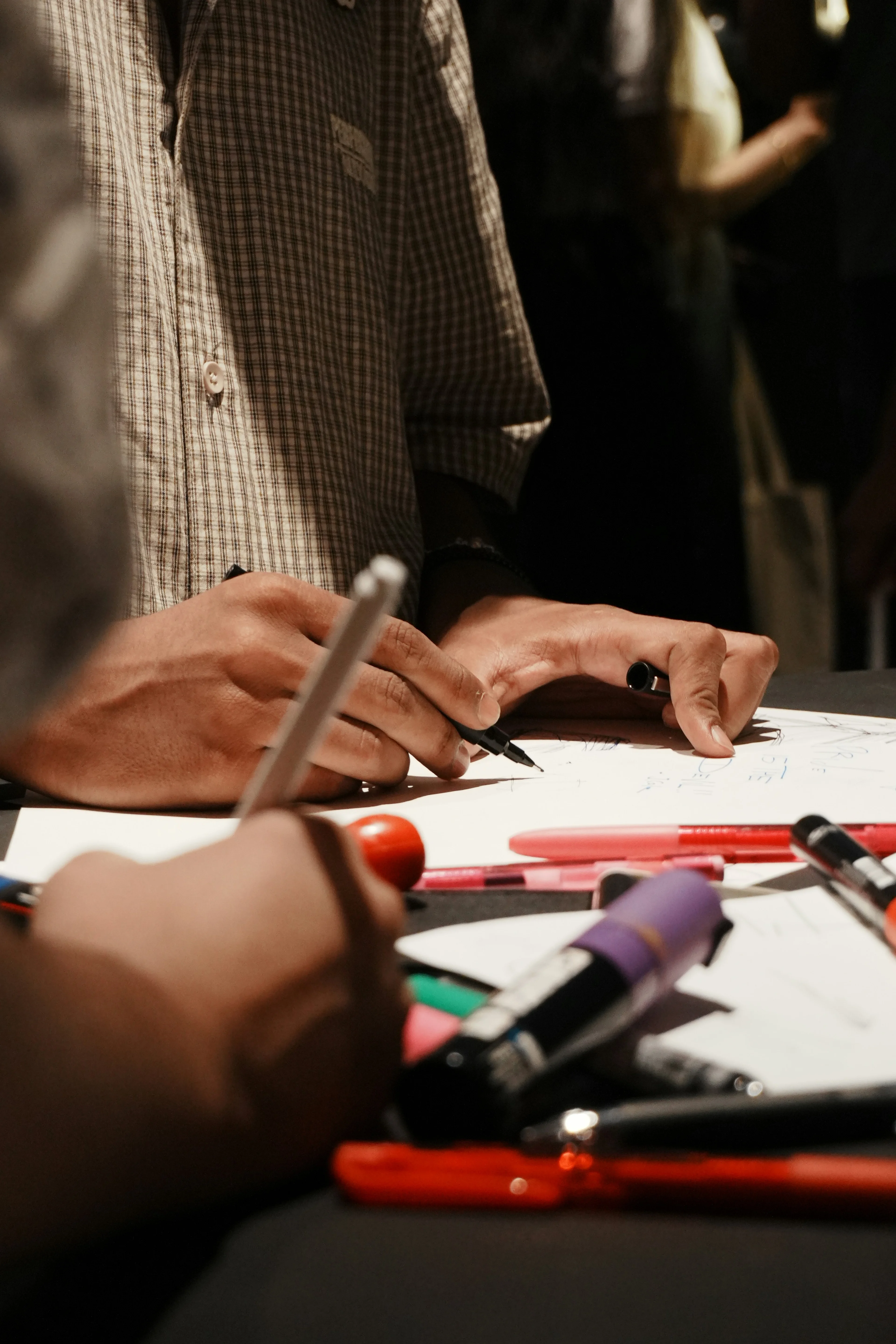 person writing with a pen