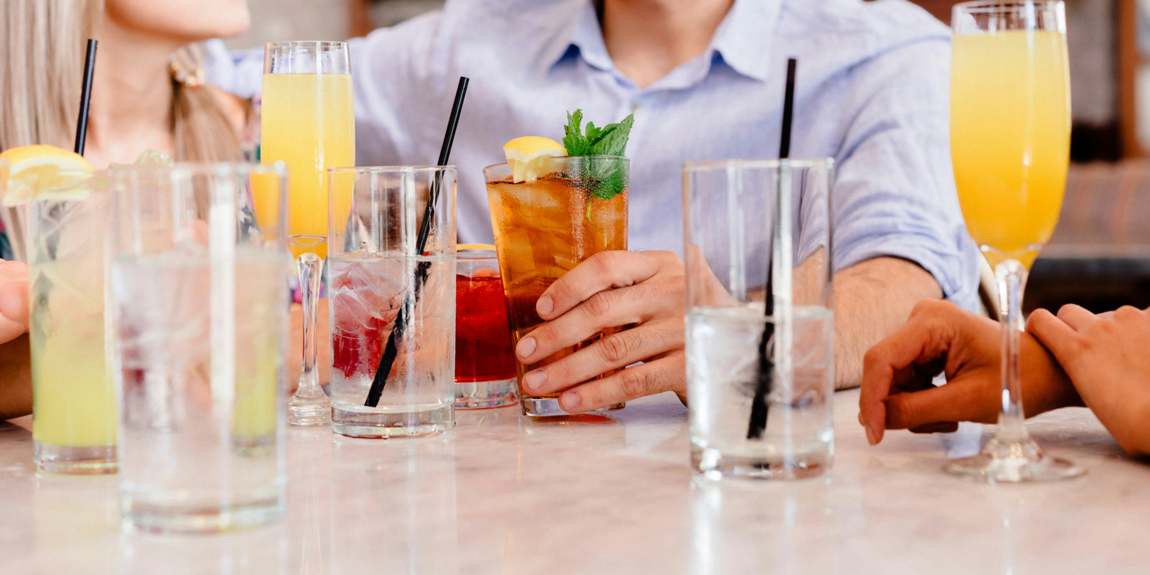 water goblets and highball glasses on the tables