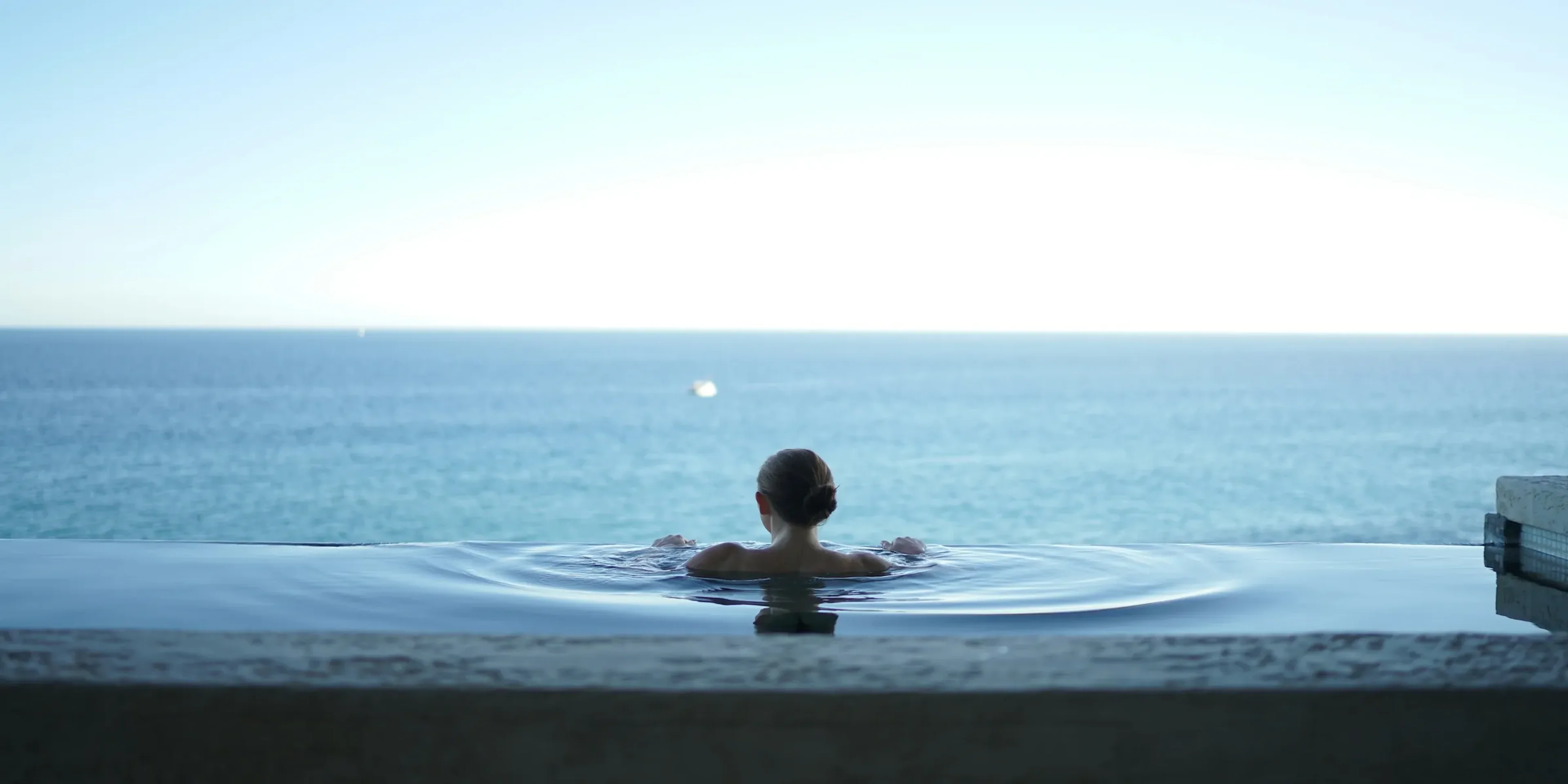 woman in a bathtub on a balcony