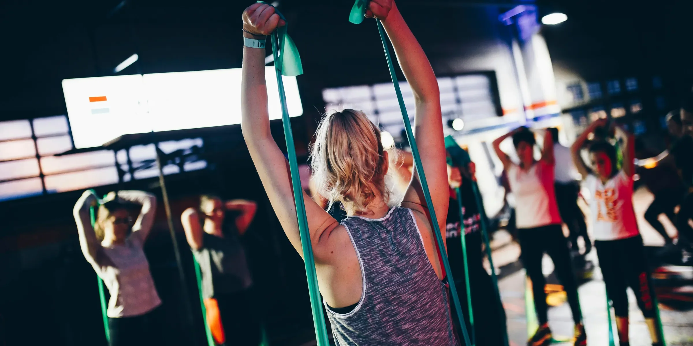group of people in gym while exercising