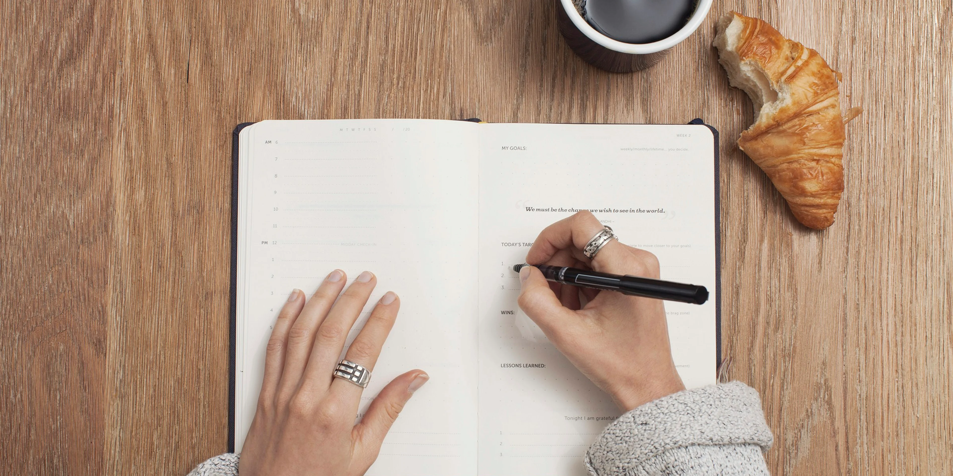person writing on a book
