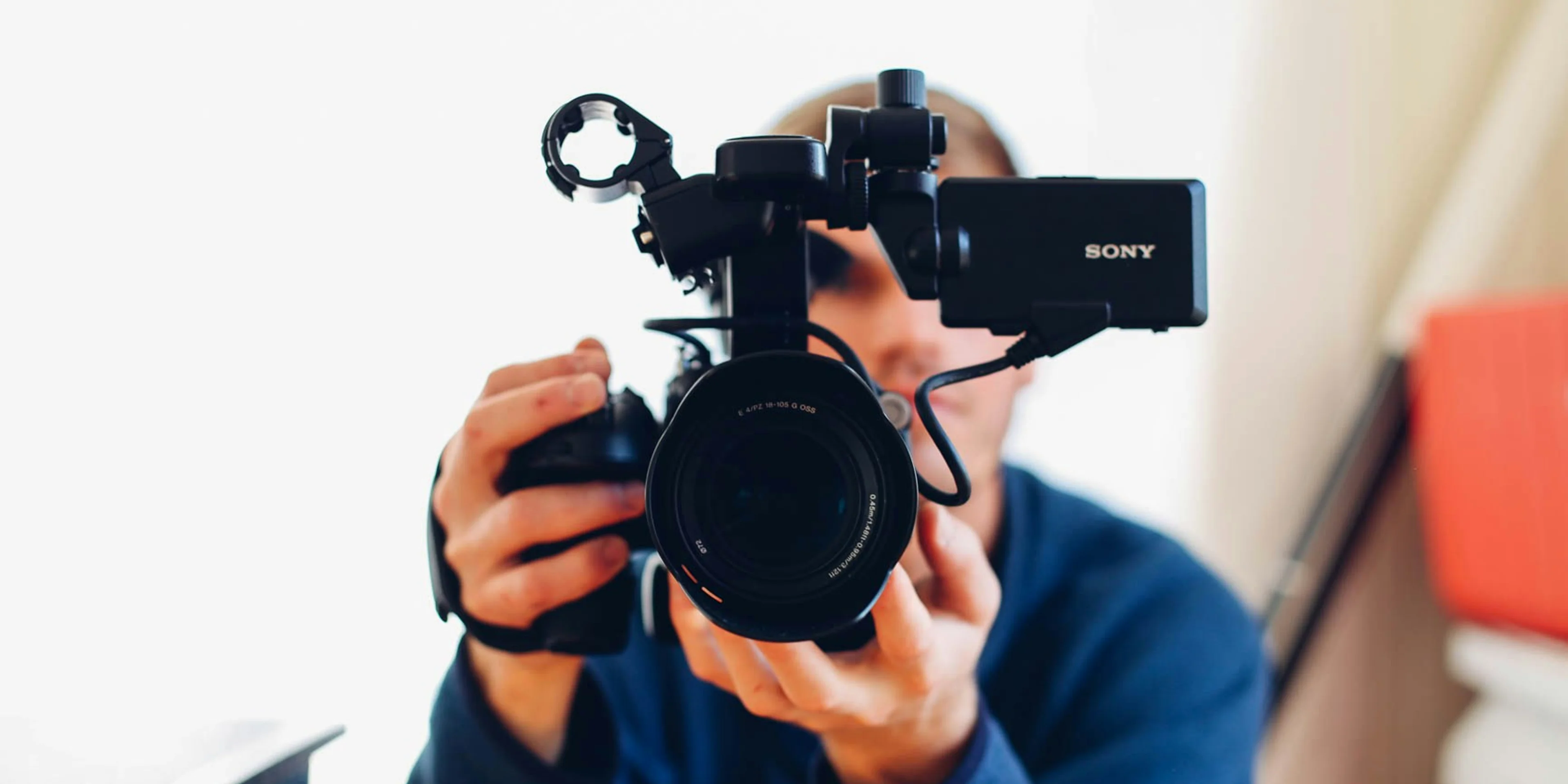 person holding DSLR camera