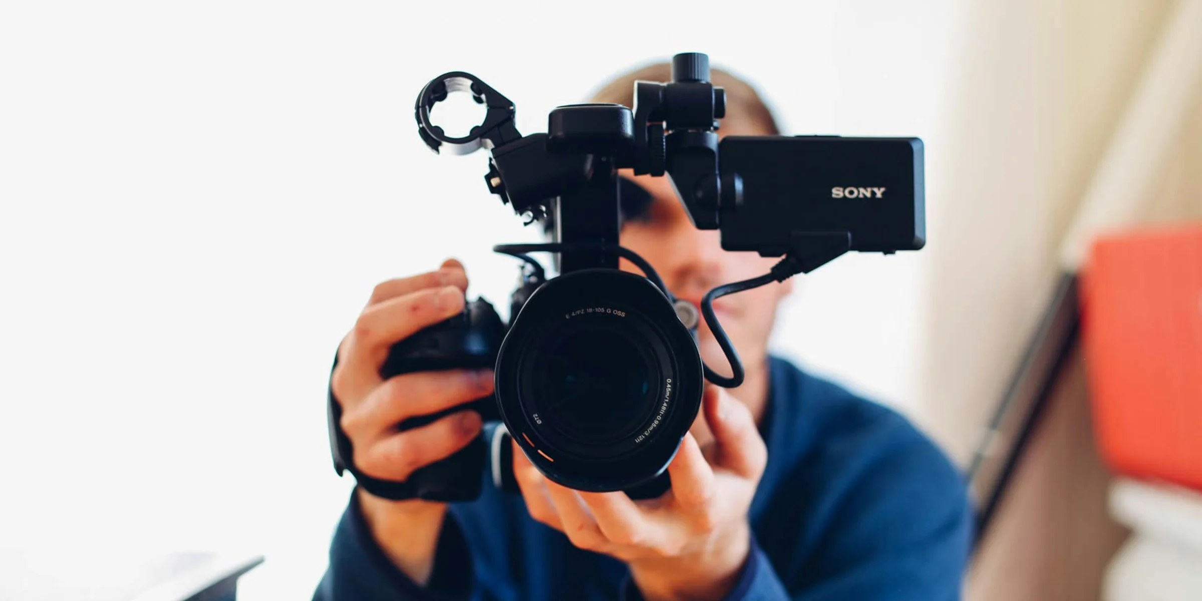 person holding DSLR camera