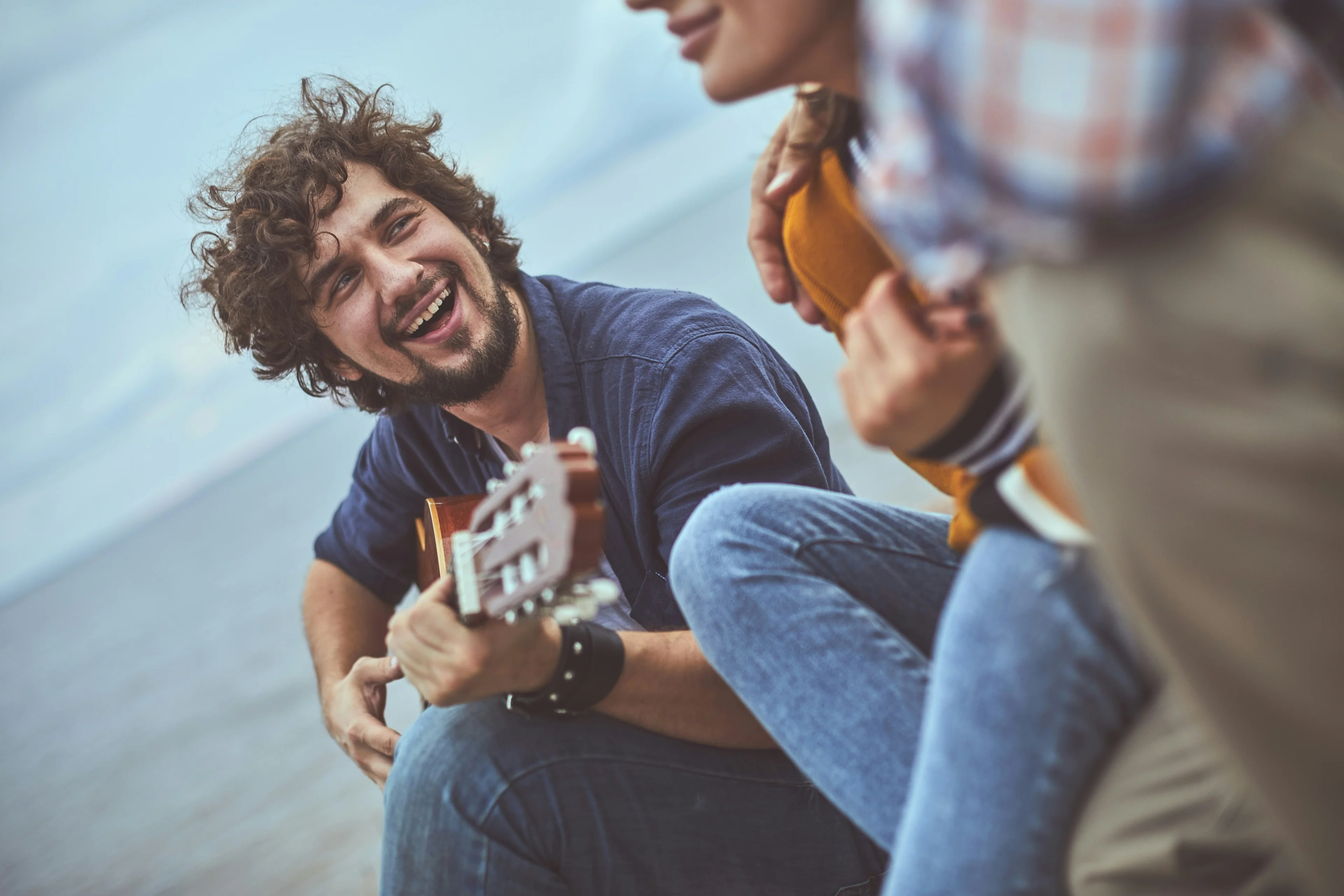 people playing guitar
