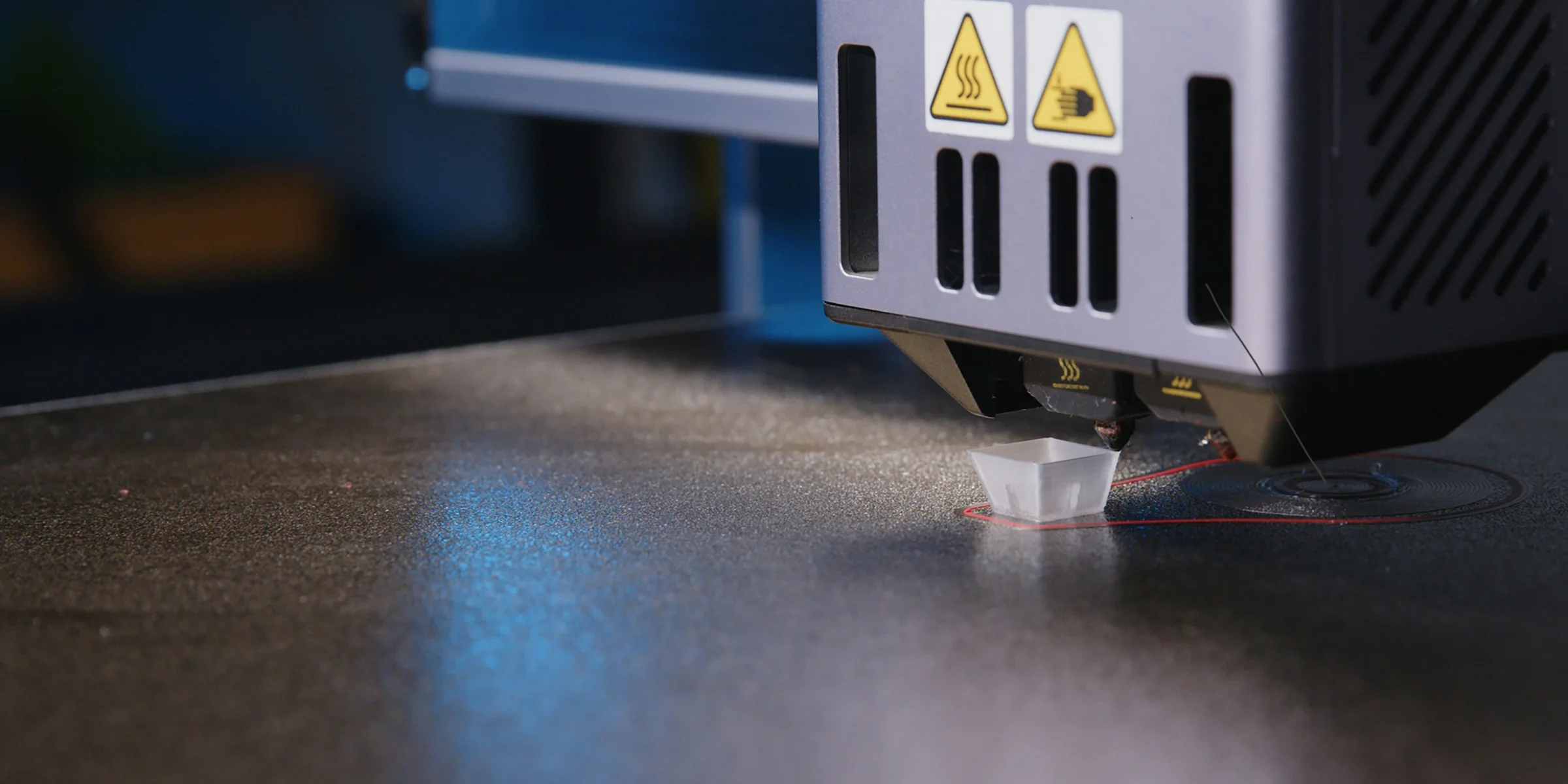 A close up of a machine that is cutting something.