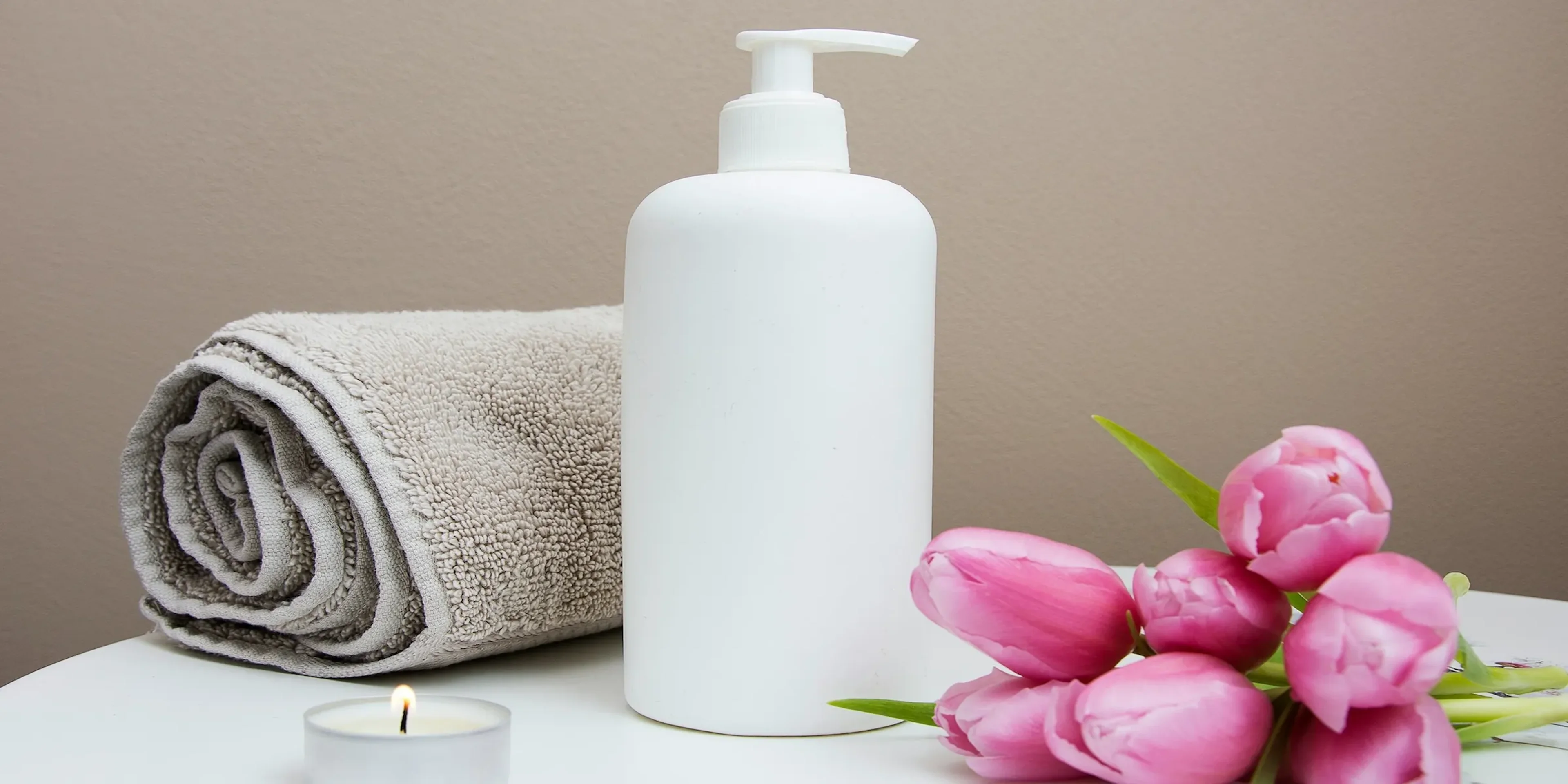 soap with towel and flowers on a table