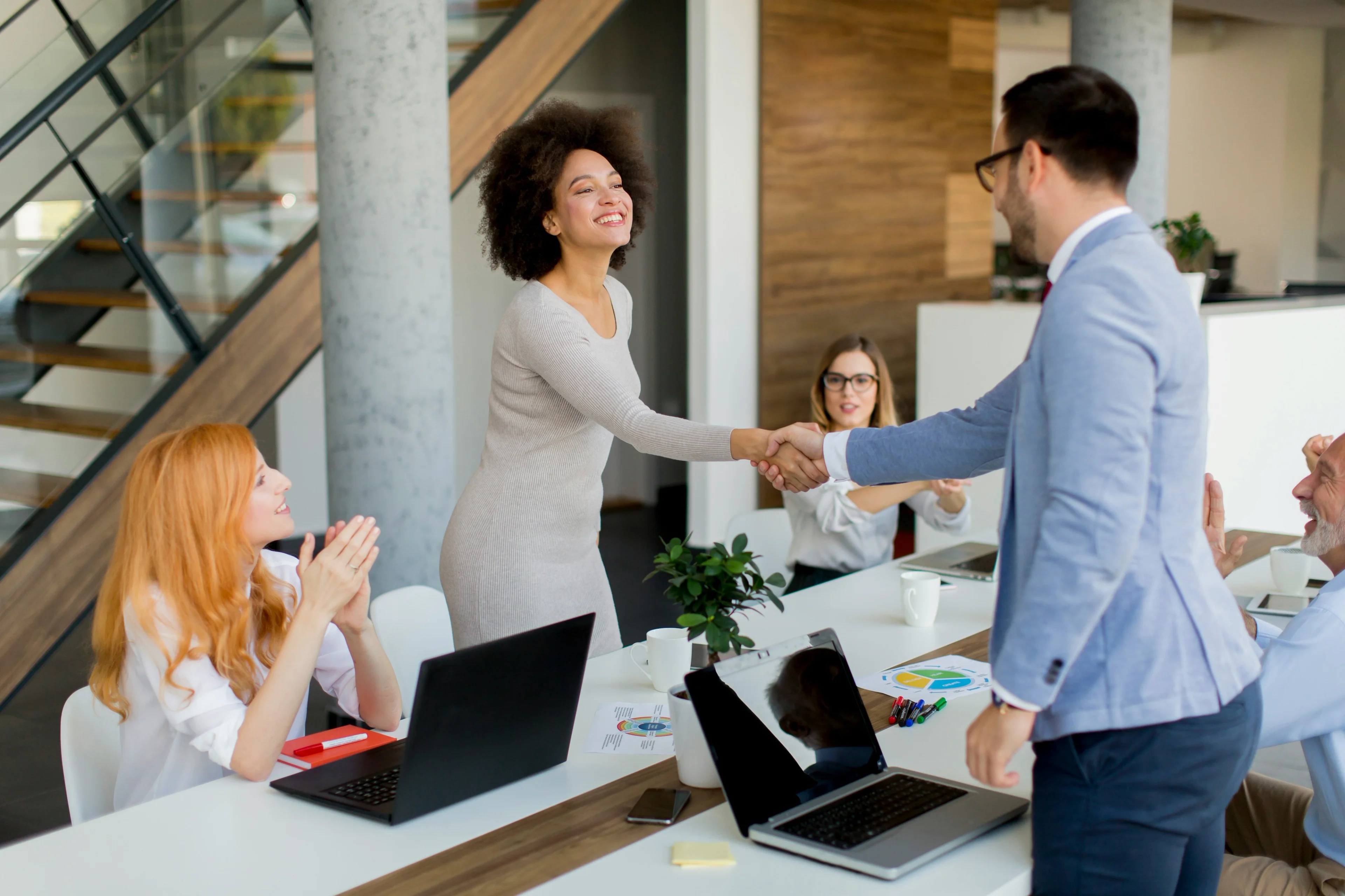 A sales team preparing personalized prospecting gifts before a pipeline review