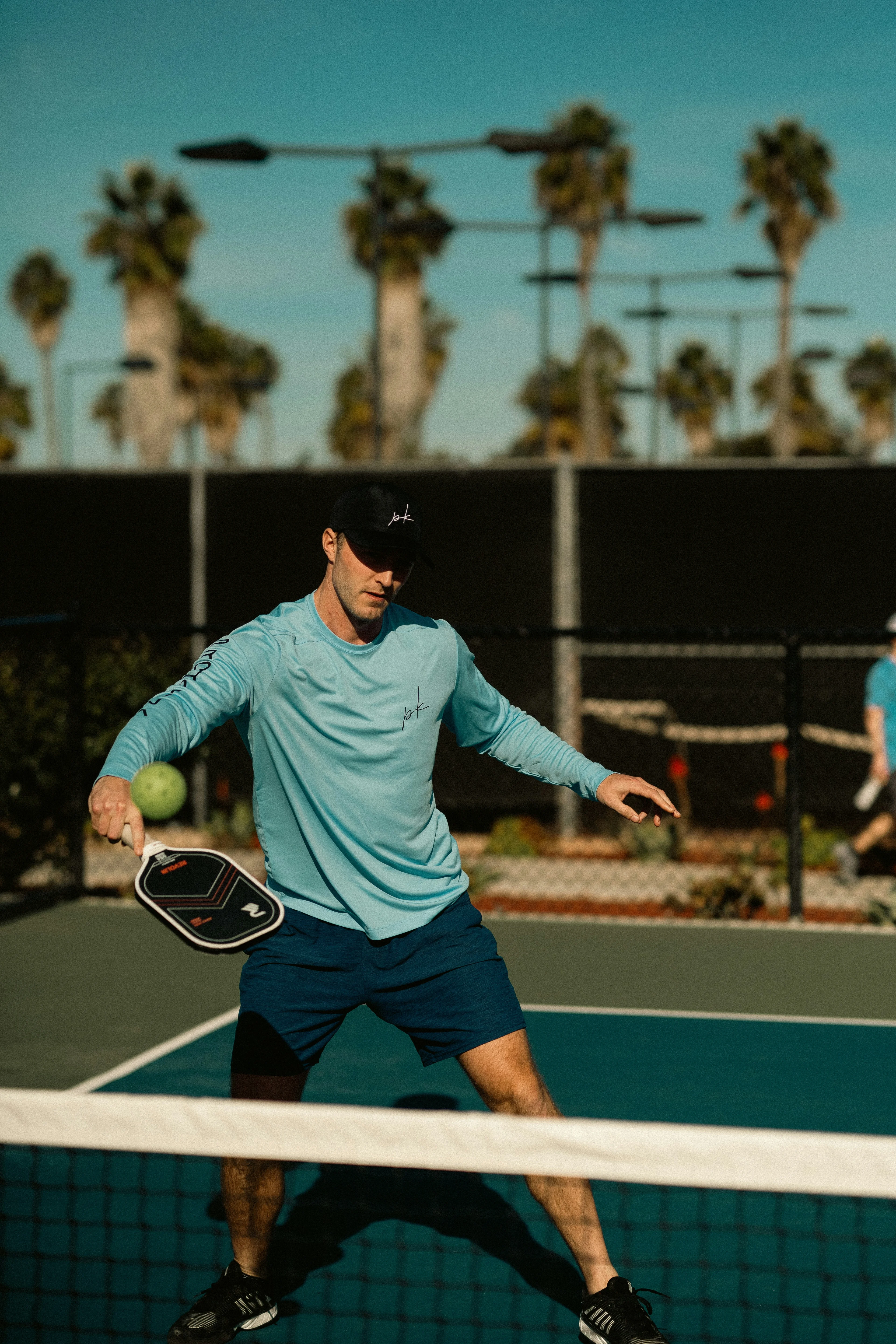 happy person playing pickleball