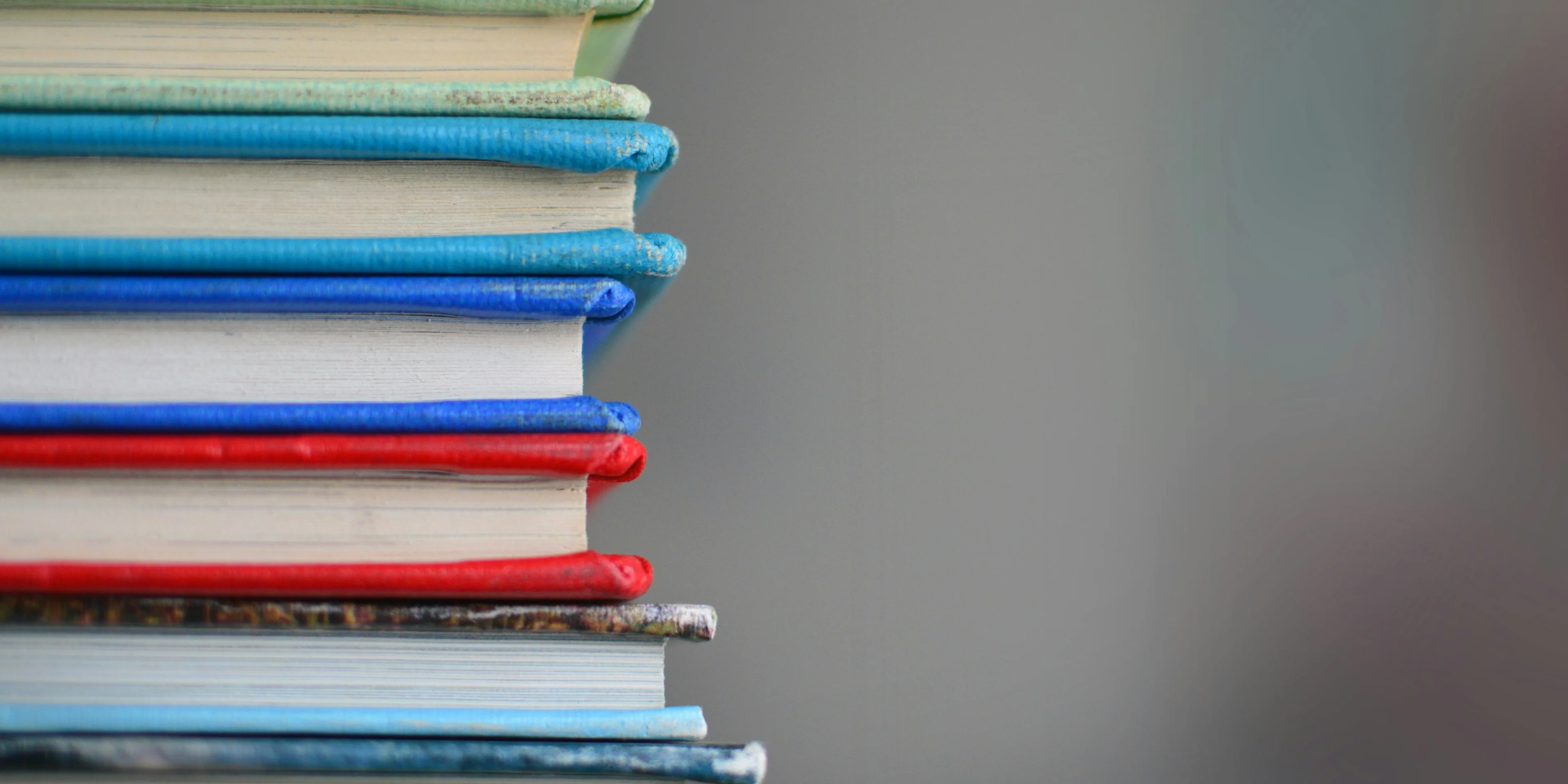 shallow focus photography of books.
