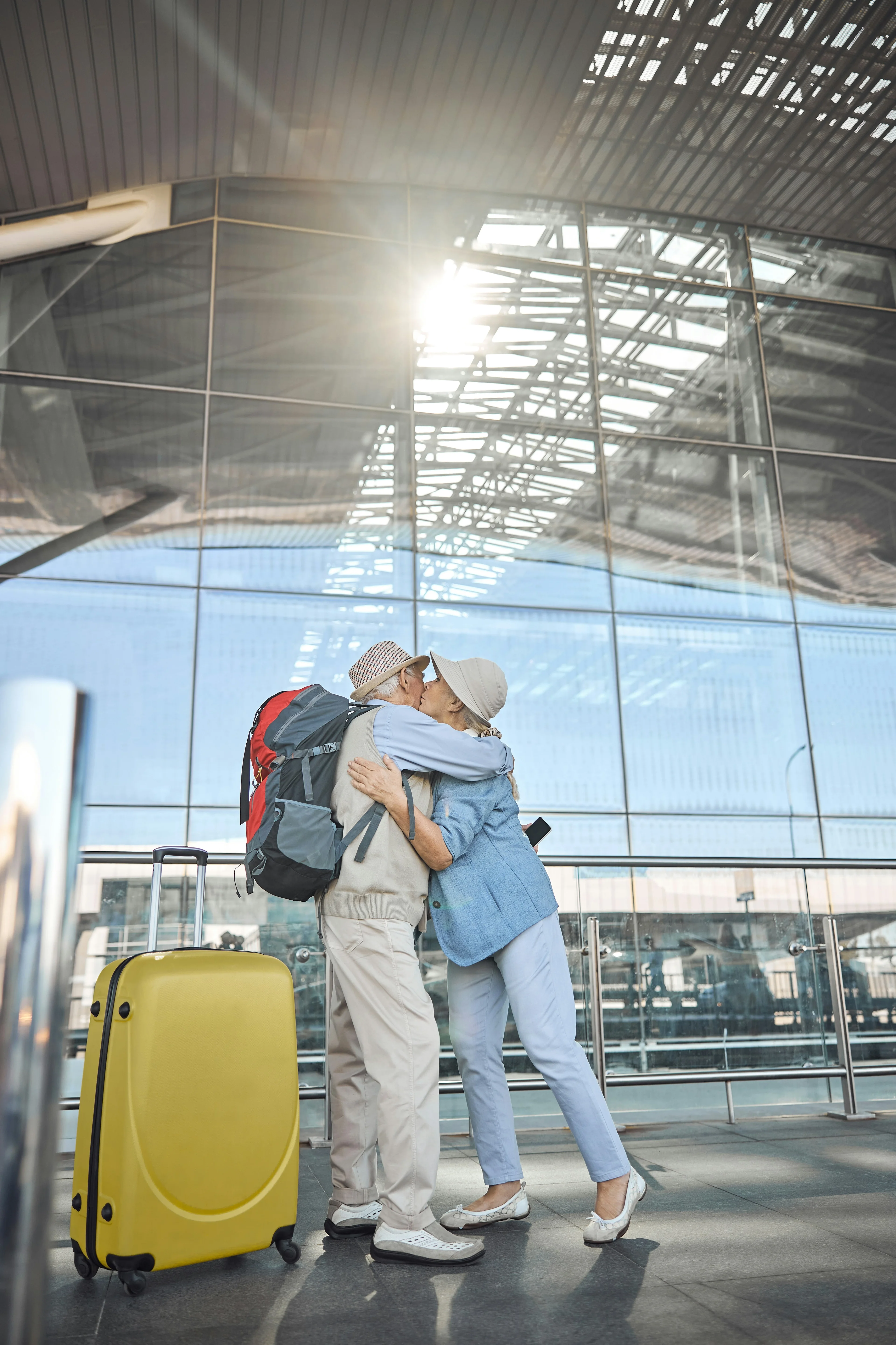 a couple embracing at the airport