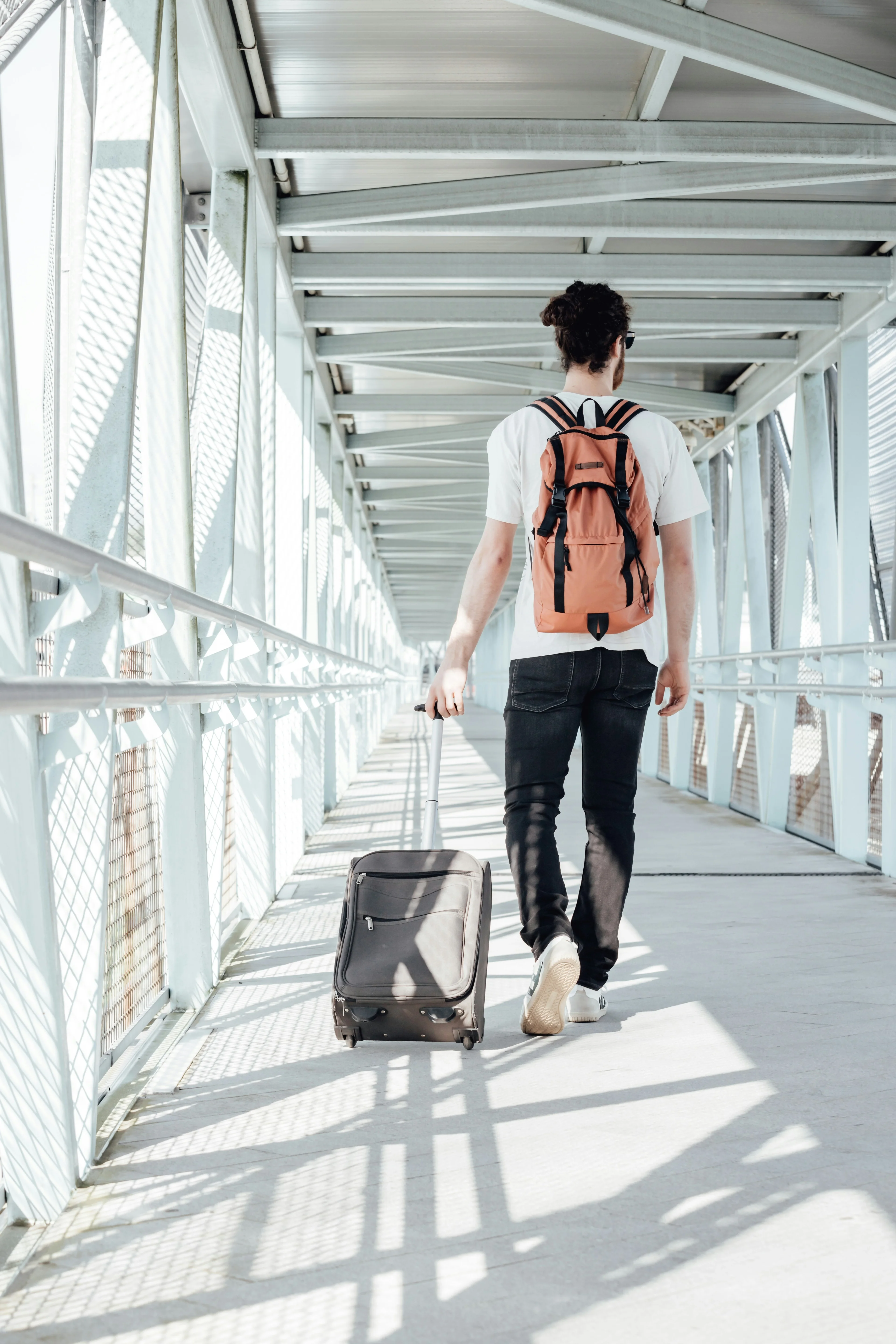 man going on a trip with his suitcase