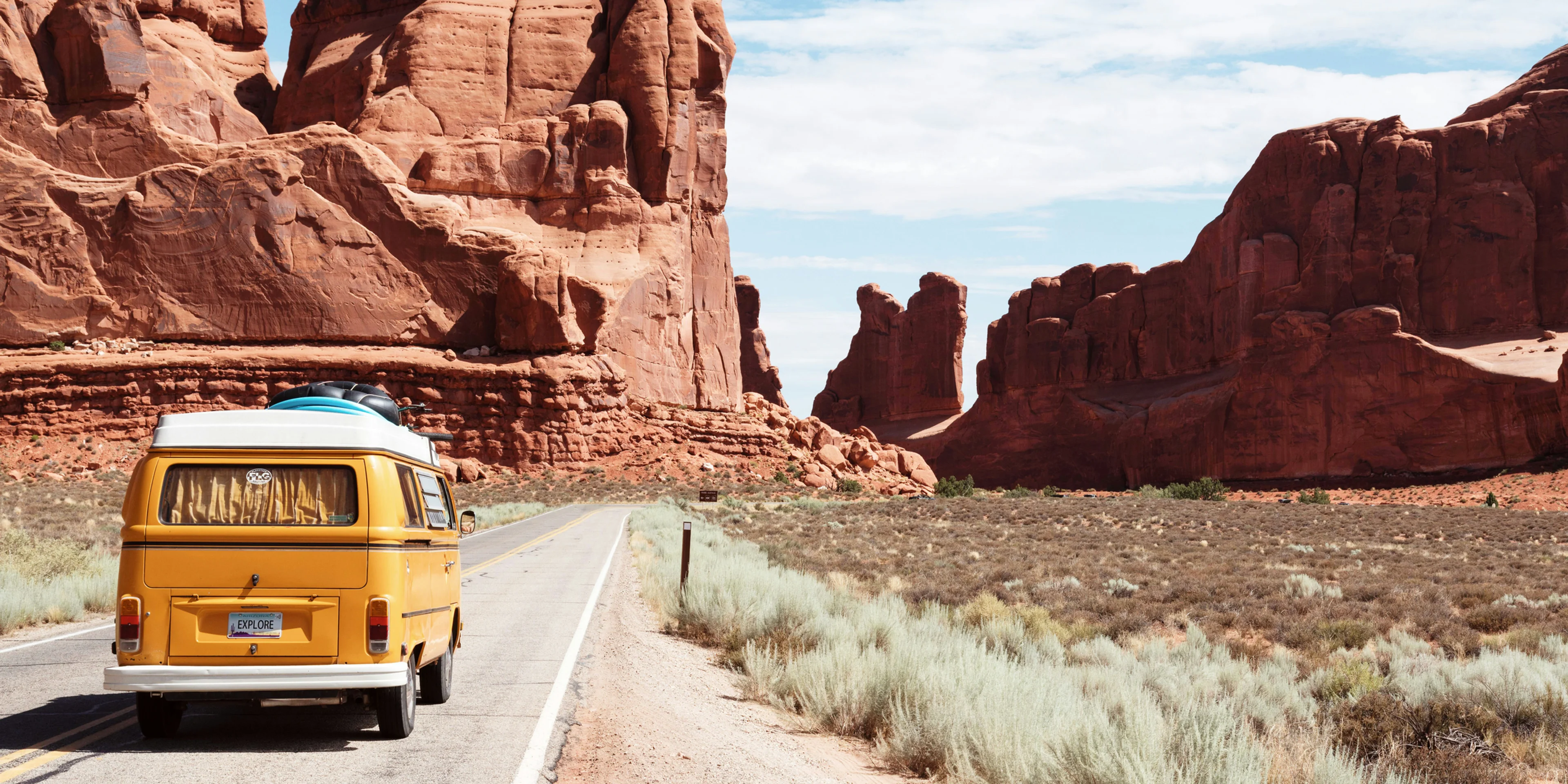 yellow Volkswagen van on road.