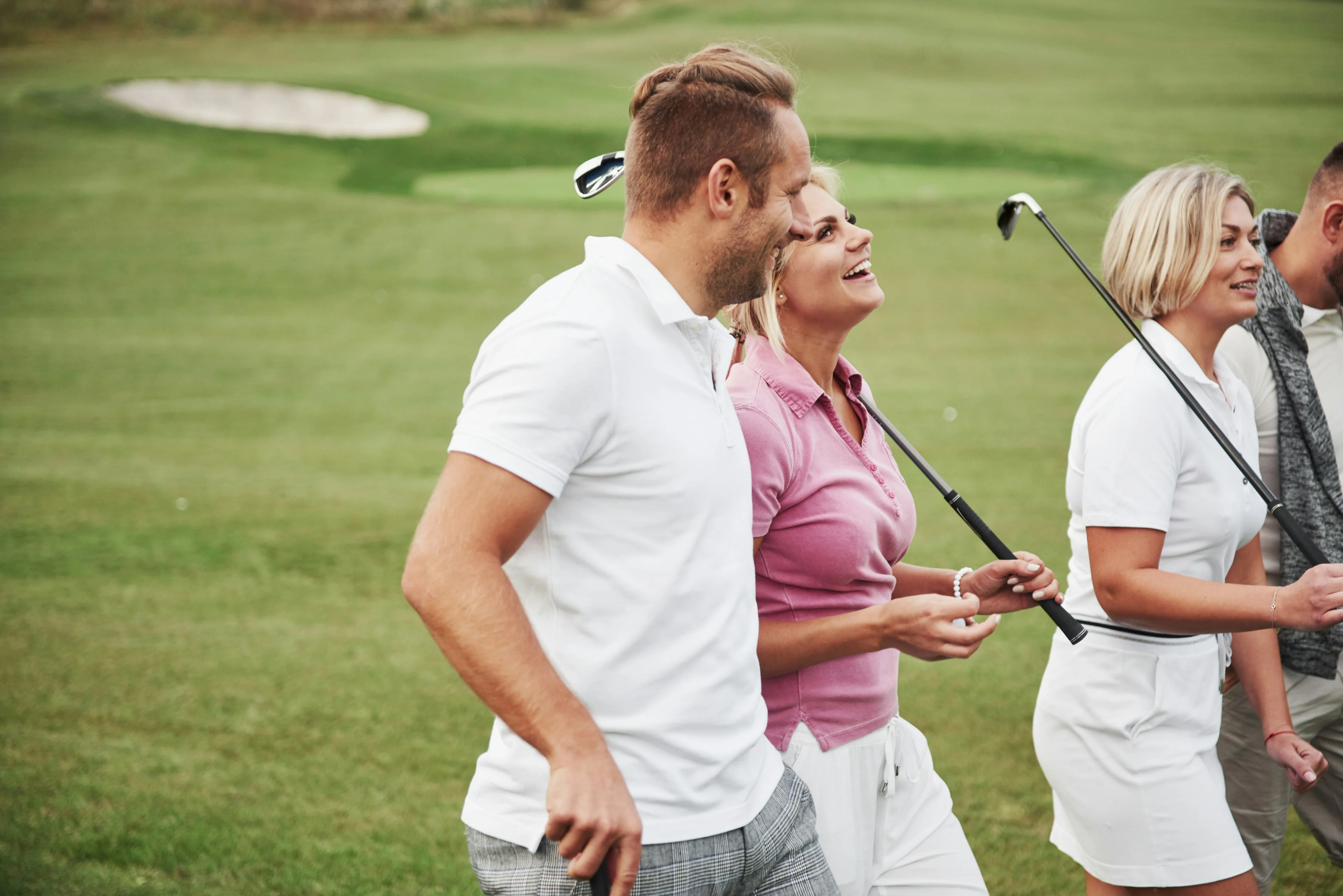people golfing