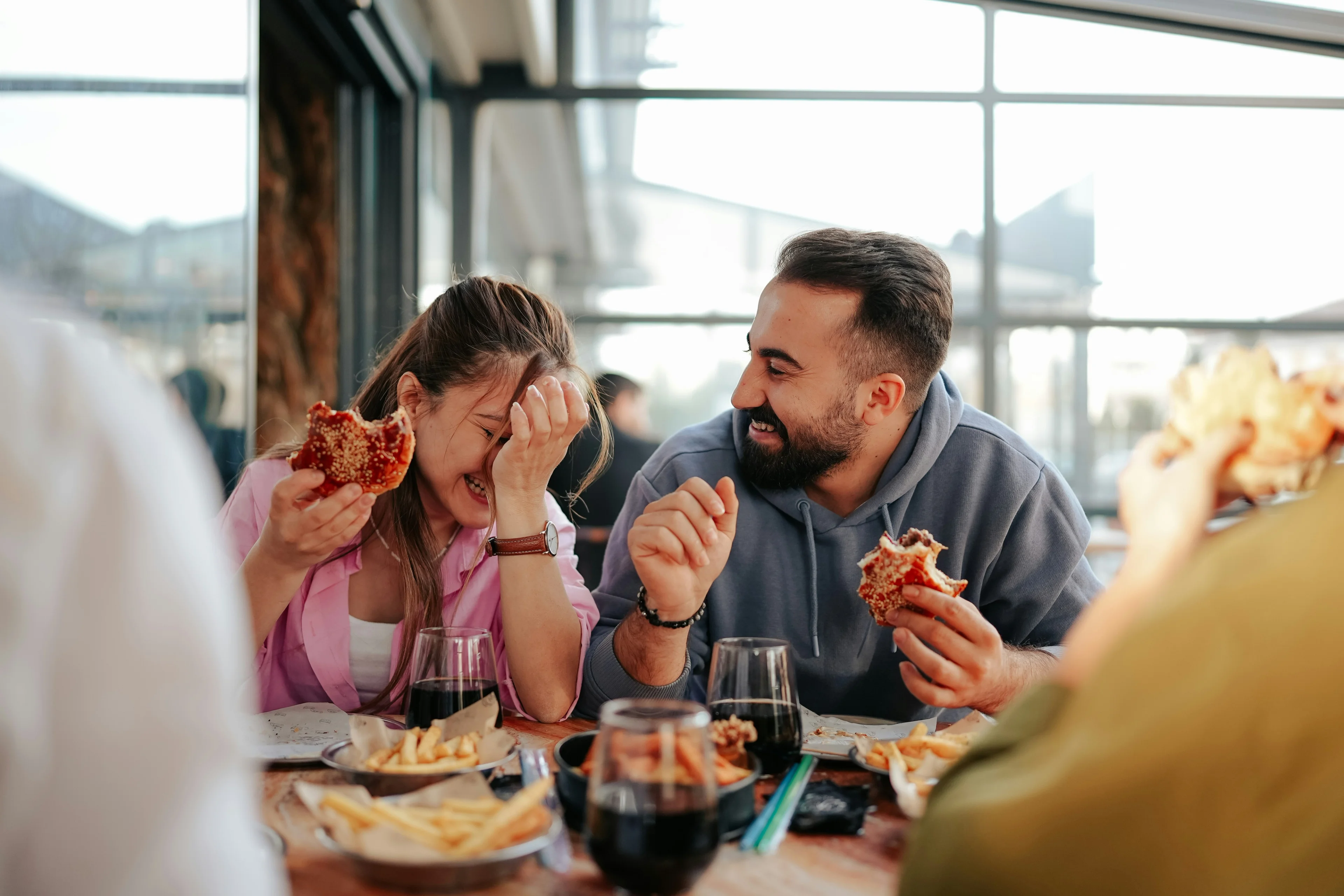 couple laughing and eating
