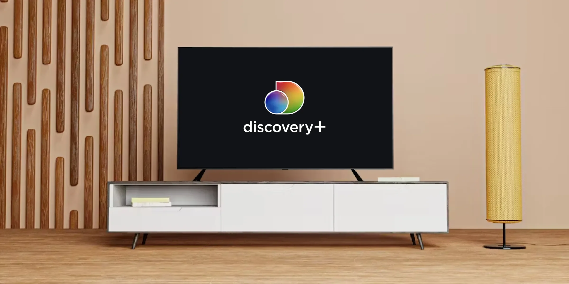 TV on a TV stand, showing the Discovery logo