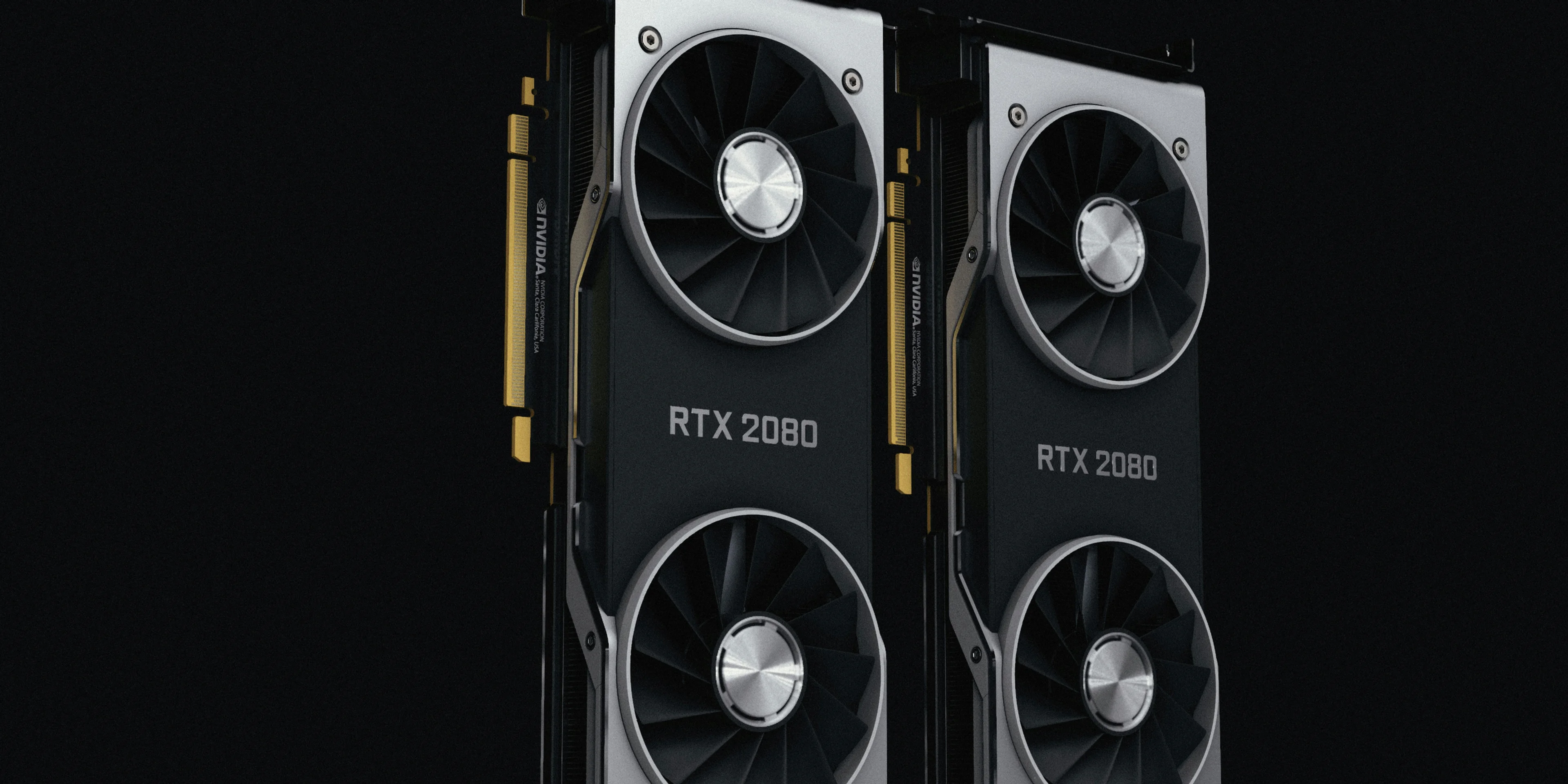 a pair of black and silver graphics cards