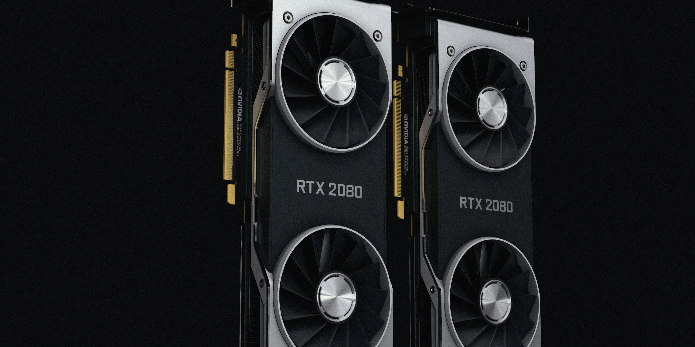 a pair of black and silver graphics cards