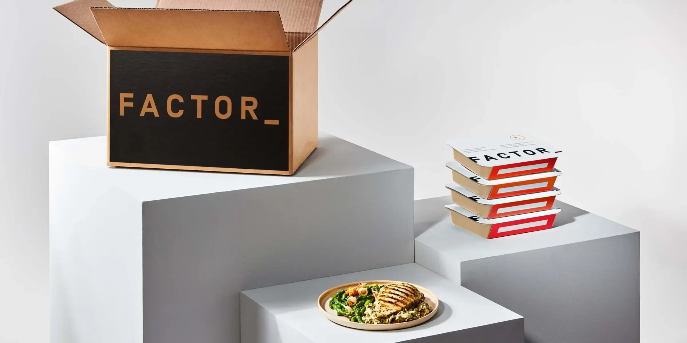 Factor-branded box, plate, and packaging on pedestals