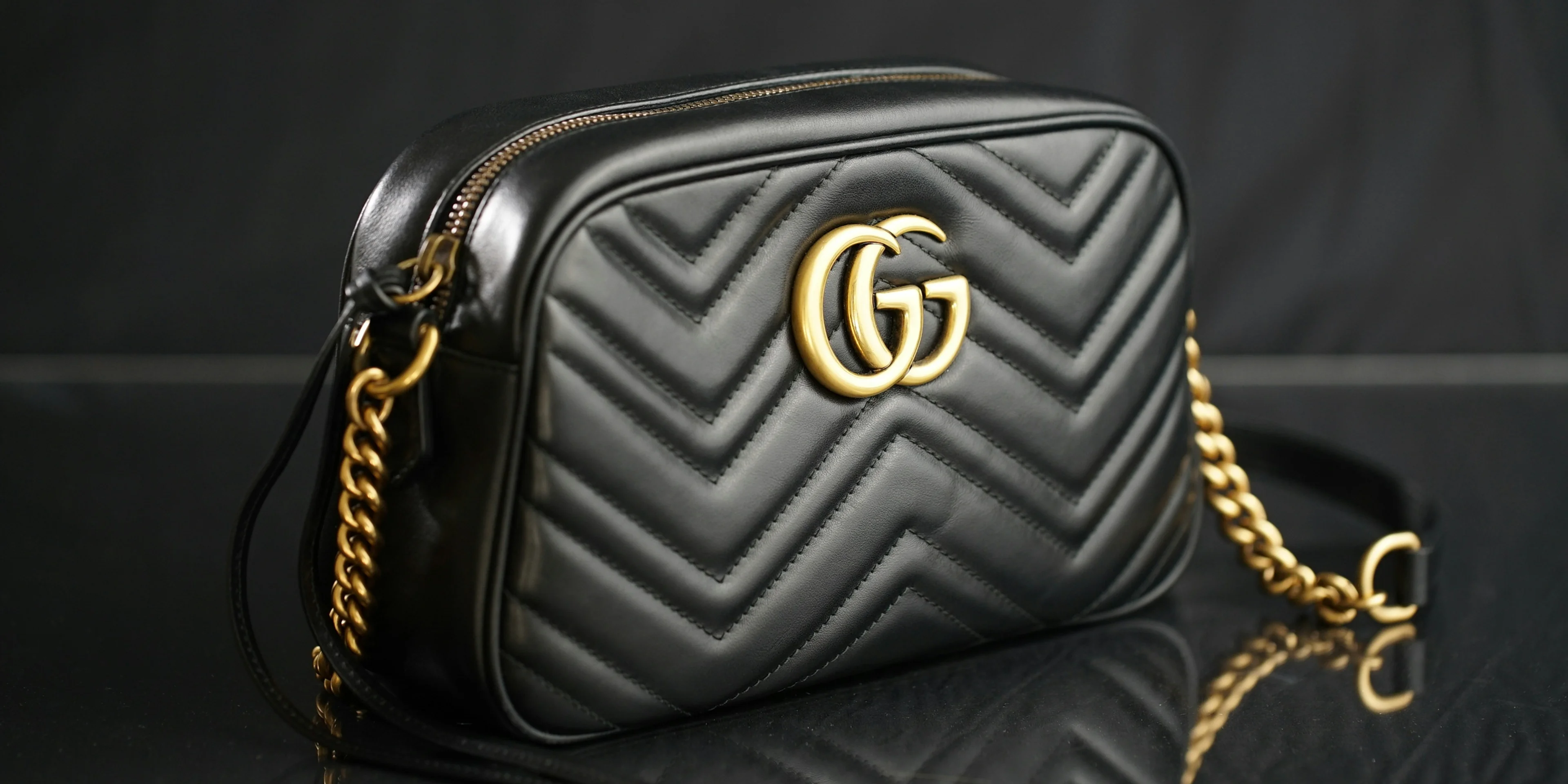 black Gucci leather shoulder bag.