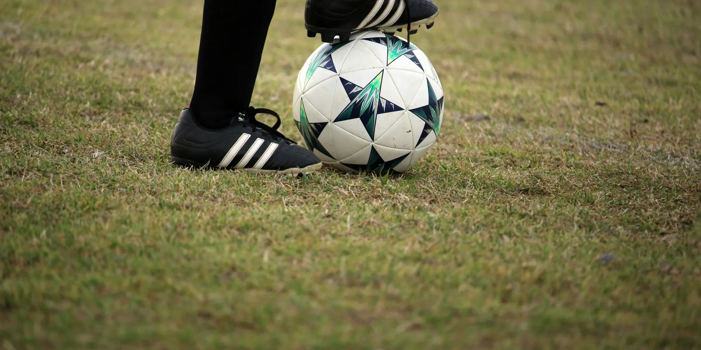 person playing soccer on field