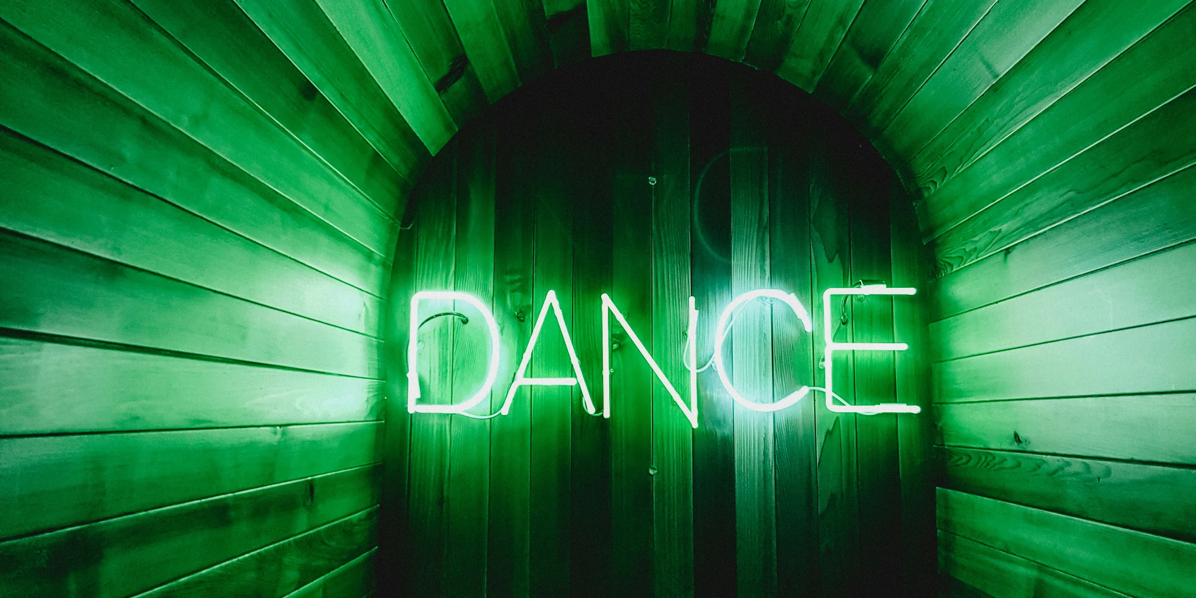 brown door with Dance neon lights.