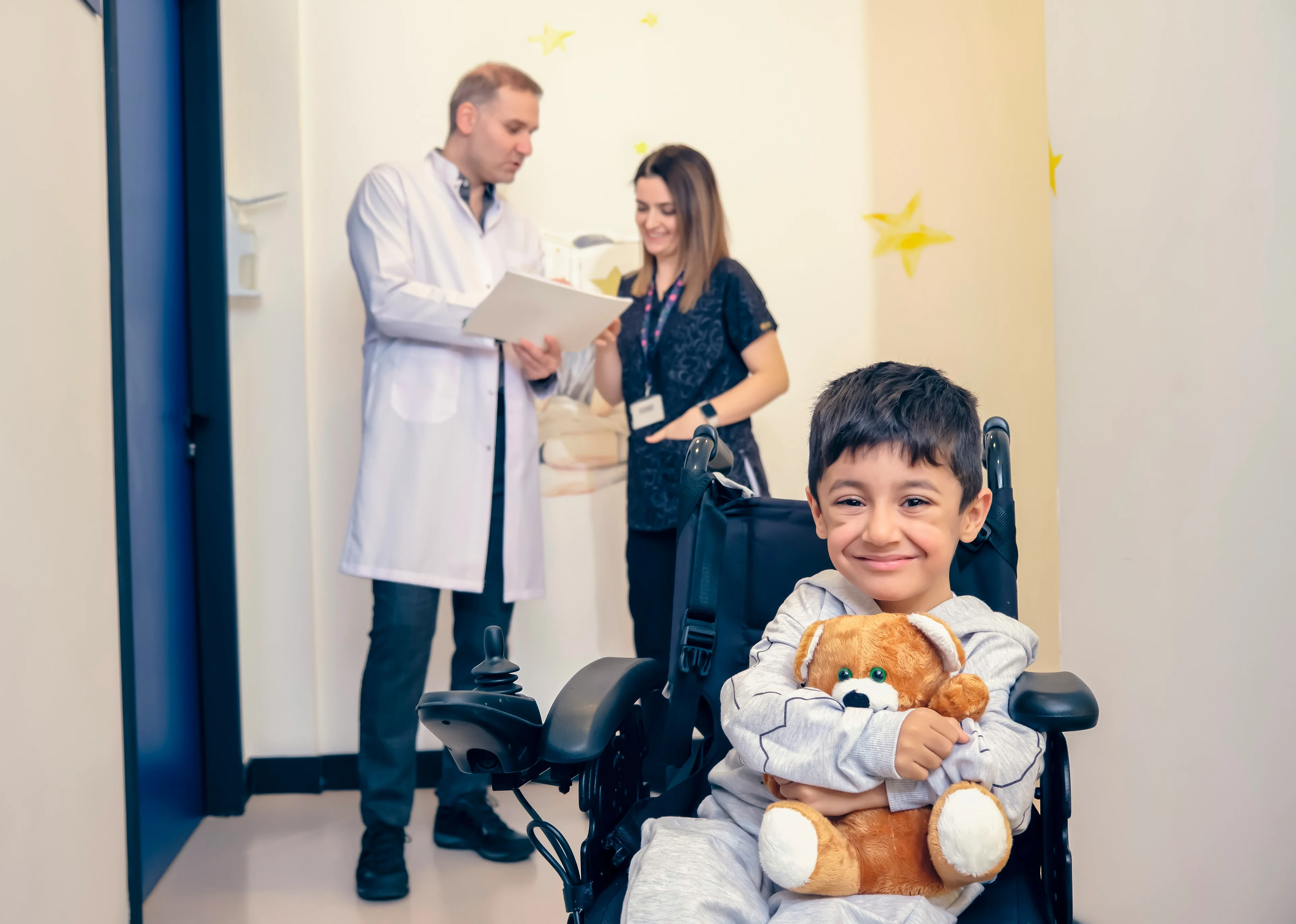 doctor speaking to parent and child smiling