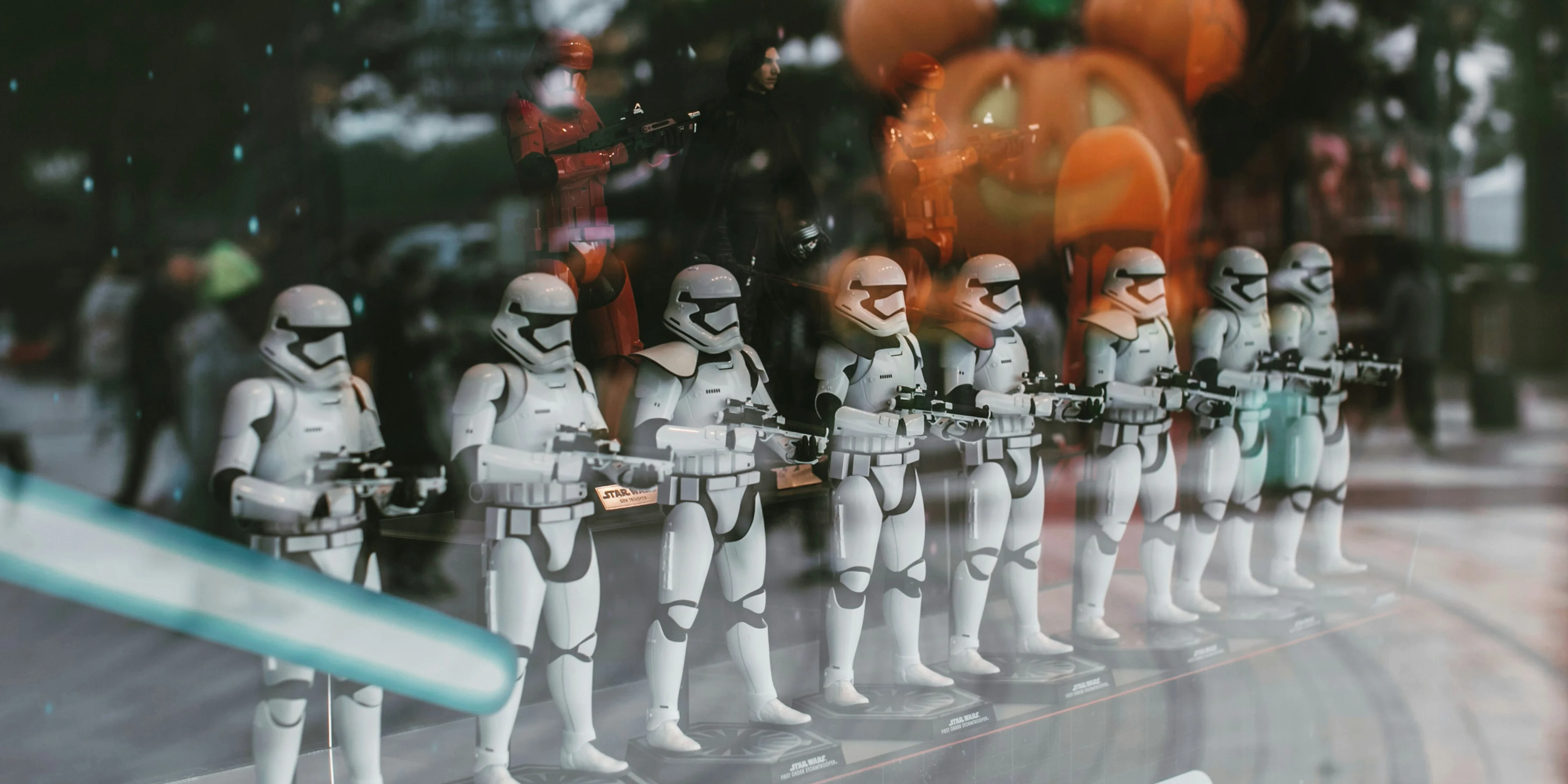 a display of star wars figurines in a store window.