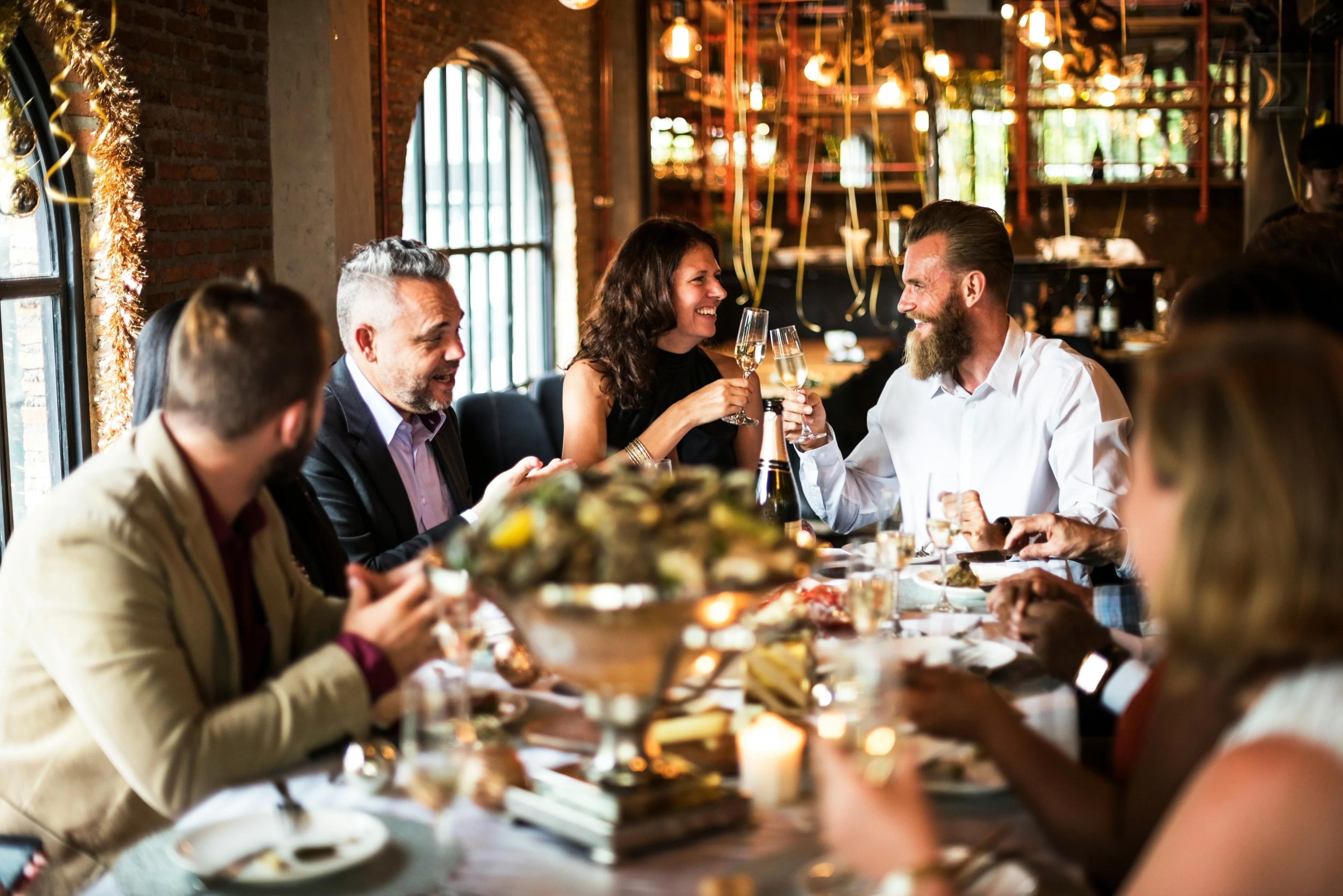 A team celebrating an employee work anniversary in the office