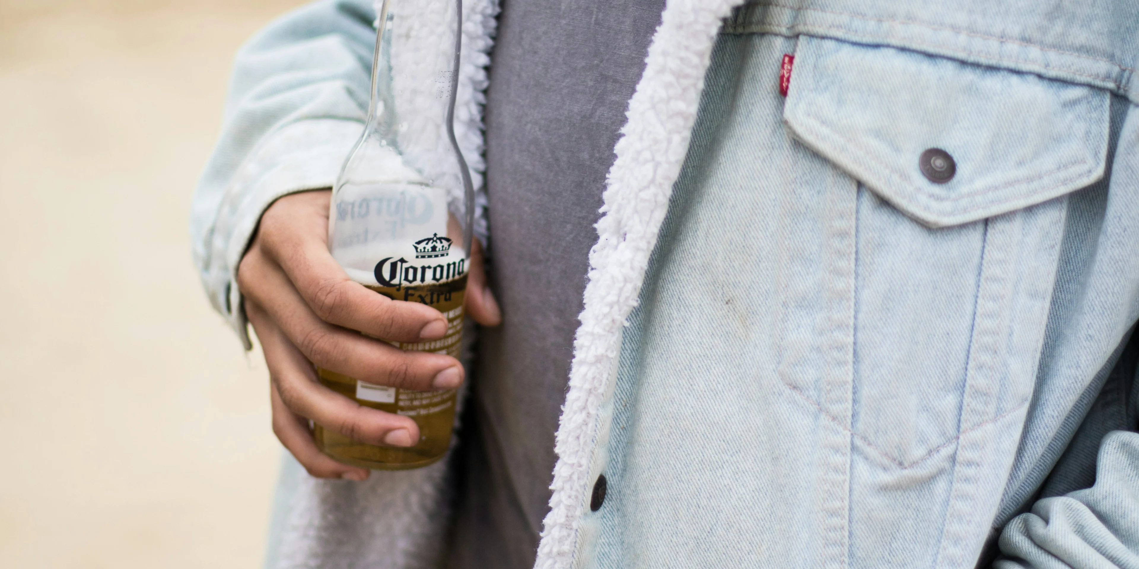 person wearing blue denim jacket.