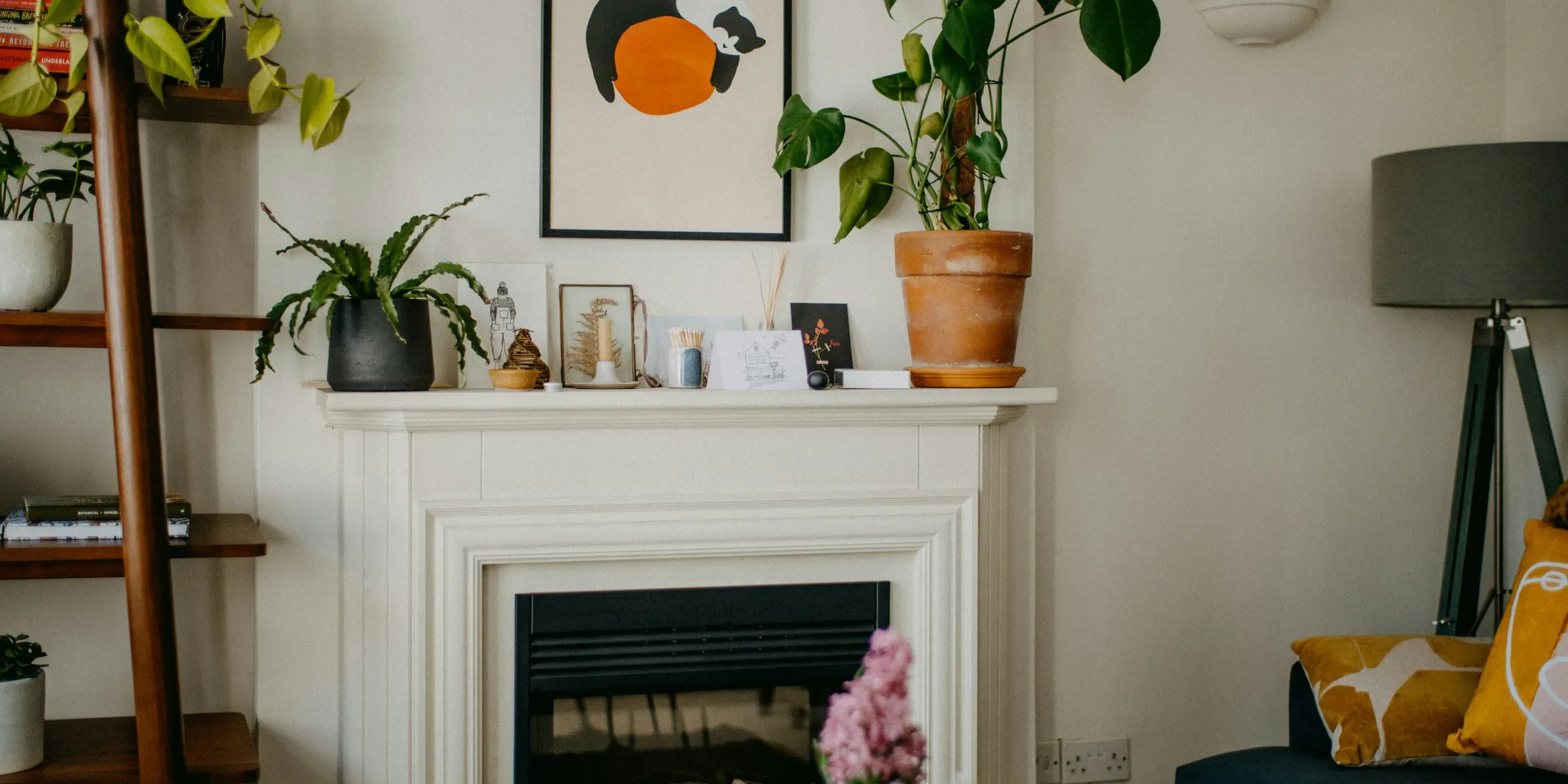 a living room filled with furniture and a fire place