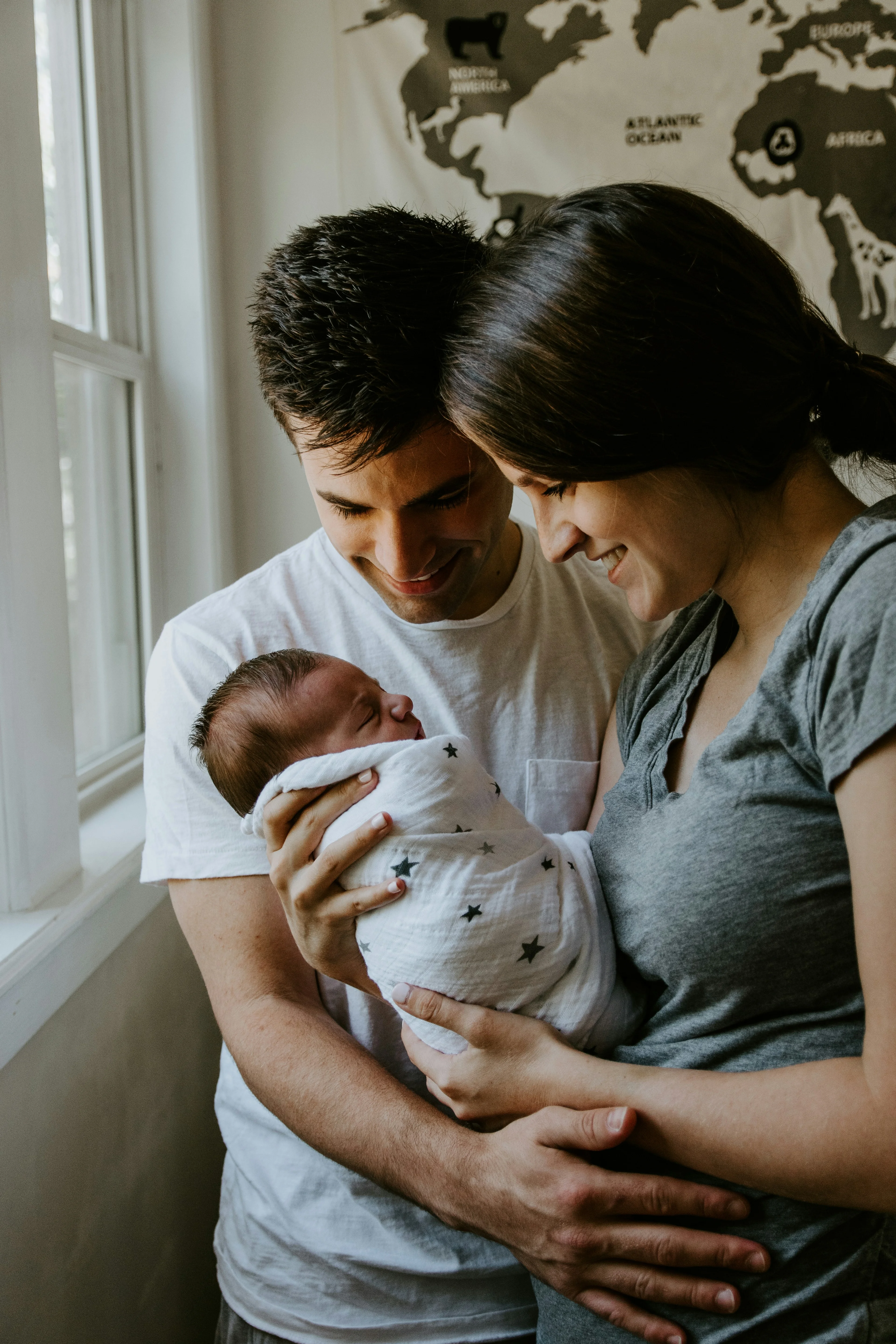 Parent holding a baby at home
