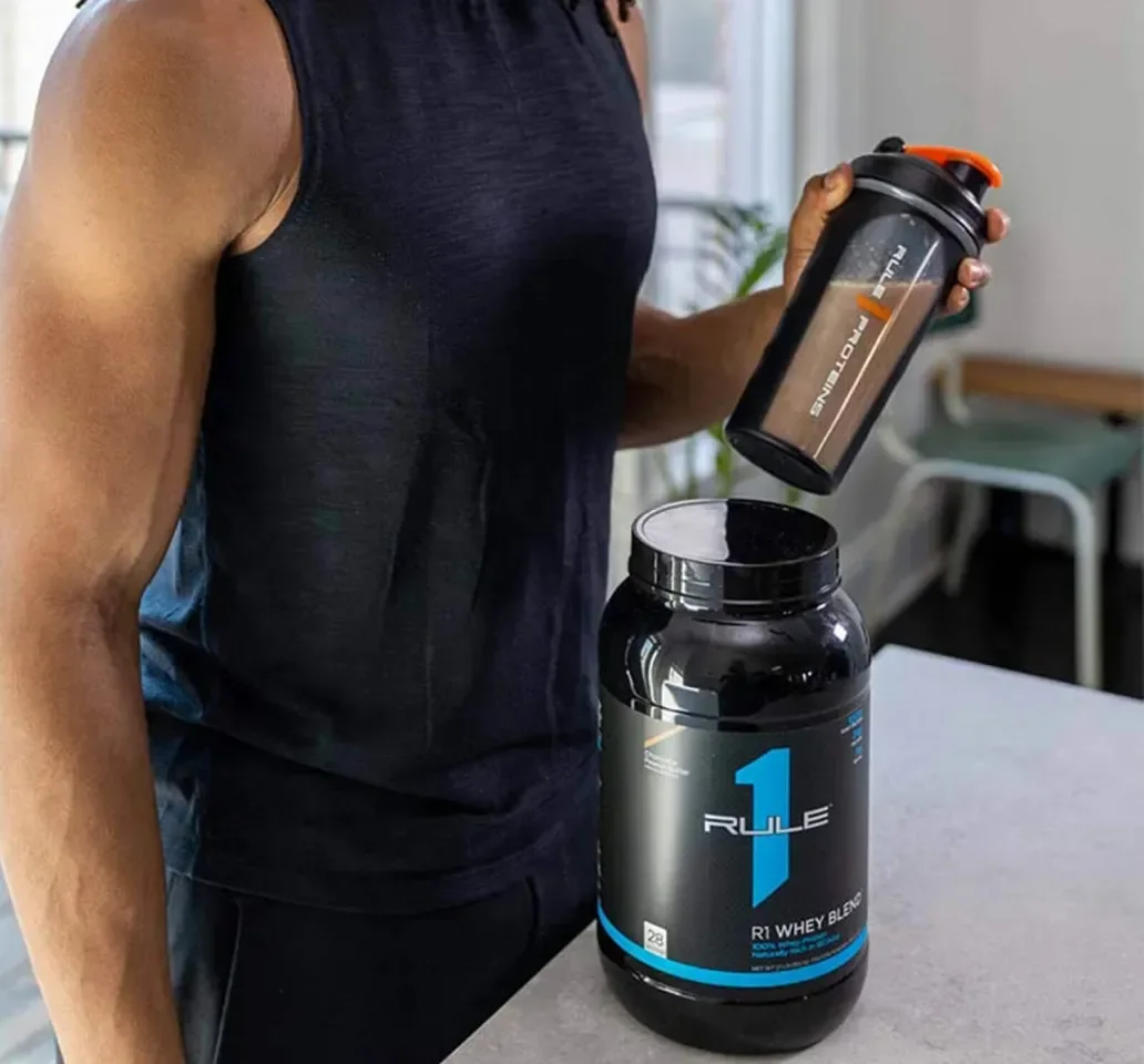 Weightlifting imagery featuring Rule 1 R1 Whey Blend