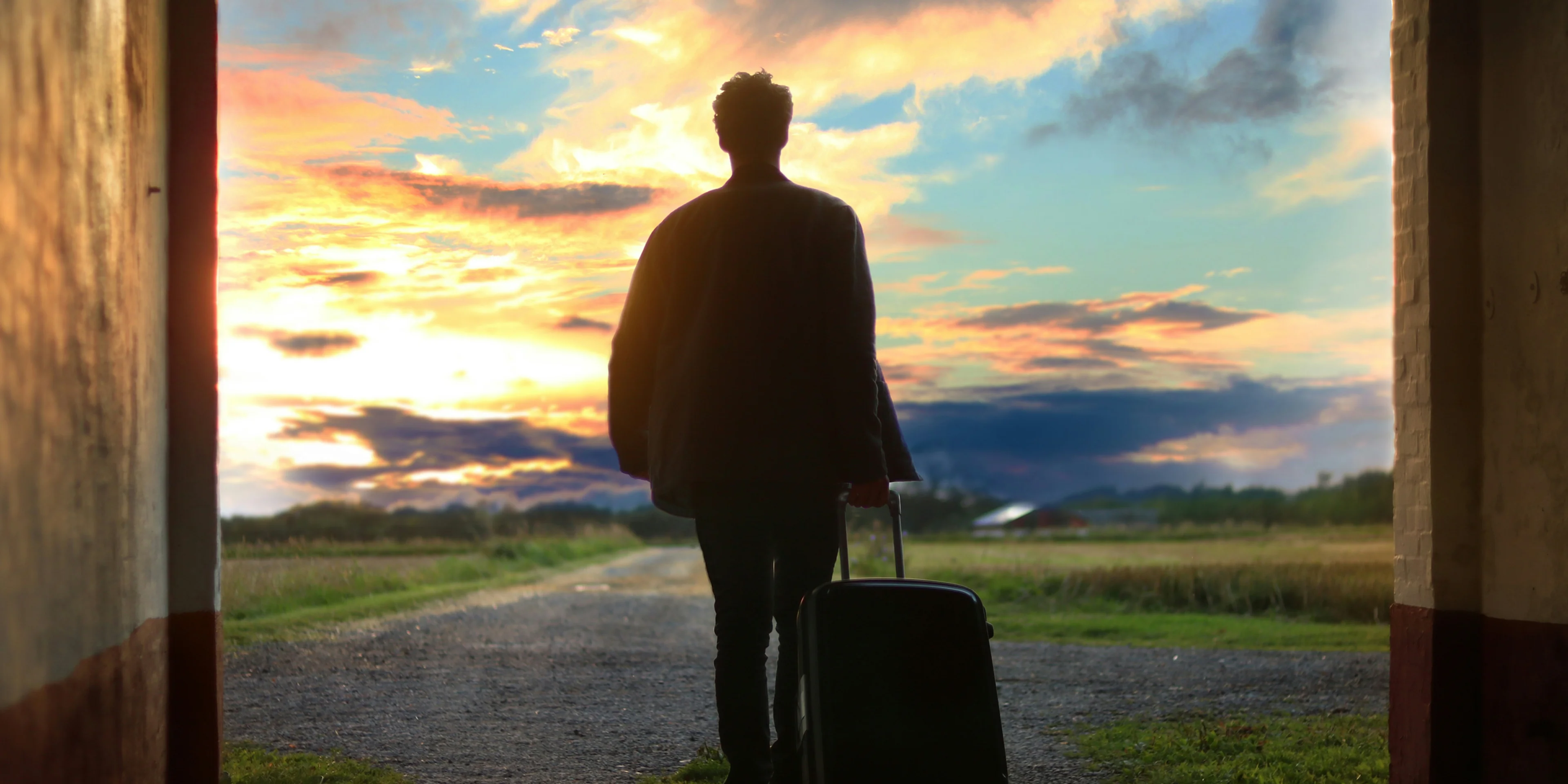 man holding luggage photo.