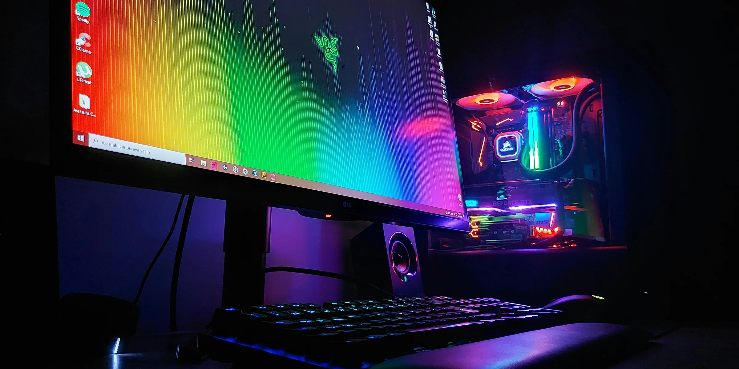 black flat screen computer monitor turned on beside black computer keyboard.