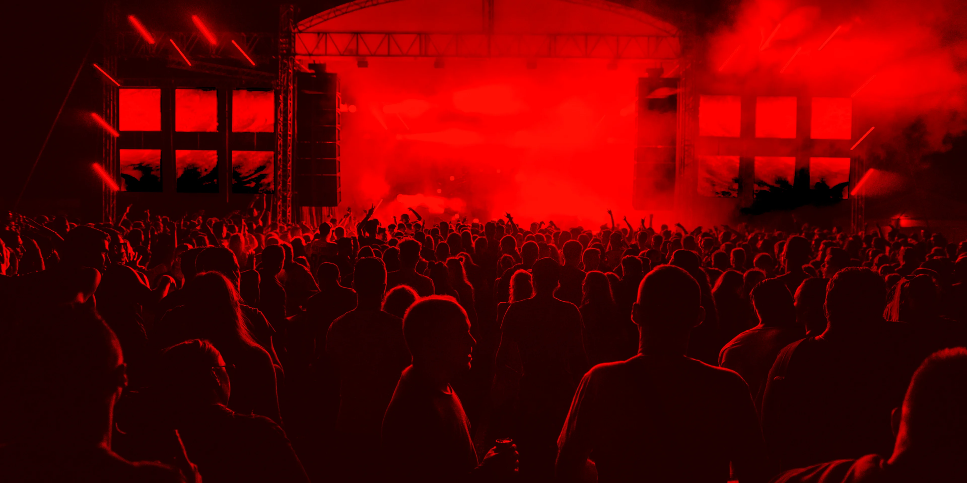 people inside concert ground at night.