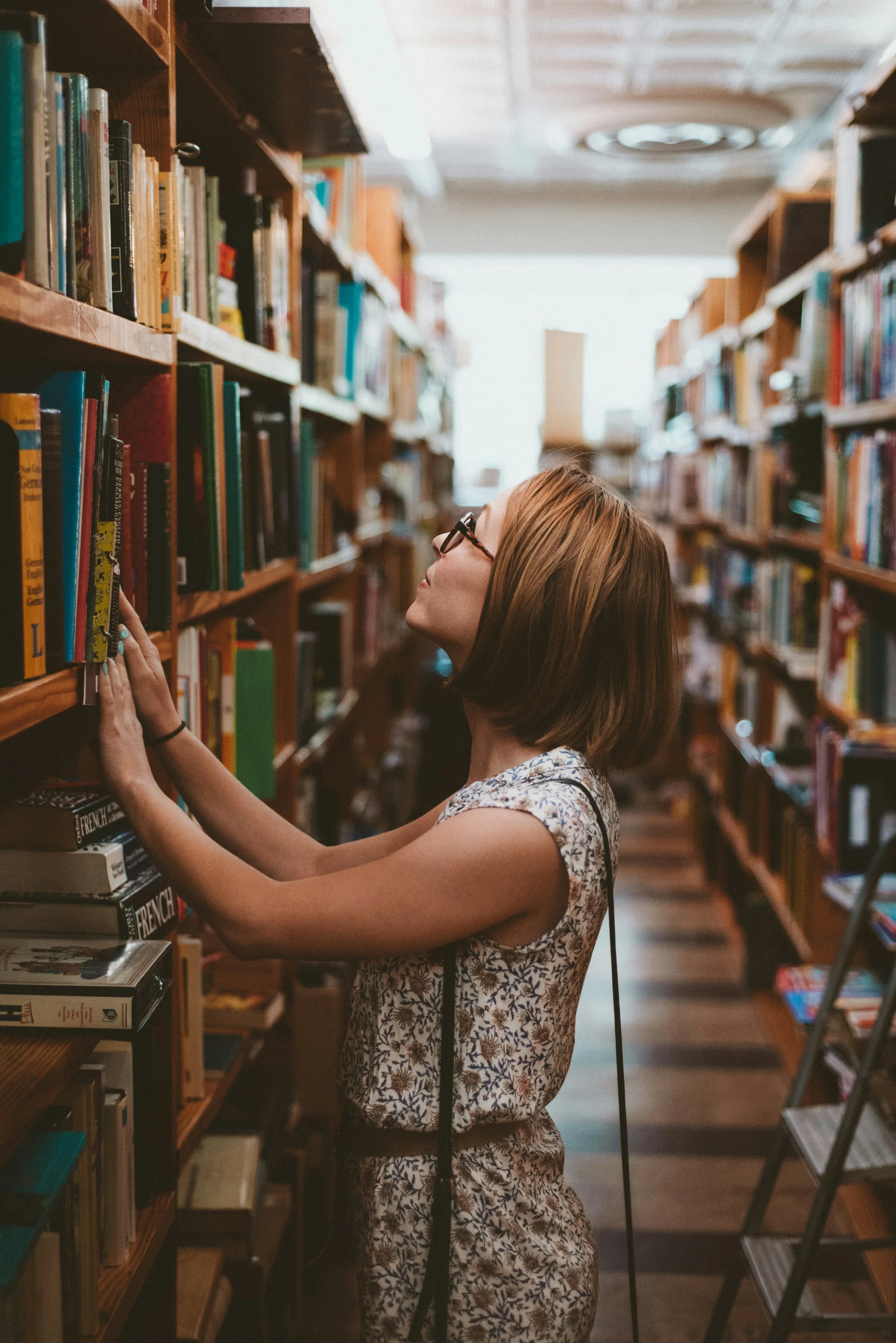 person walking around book store