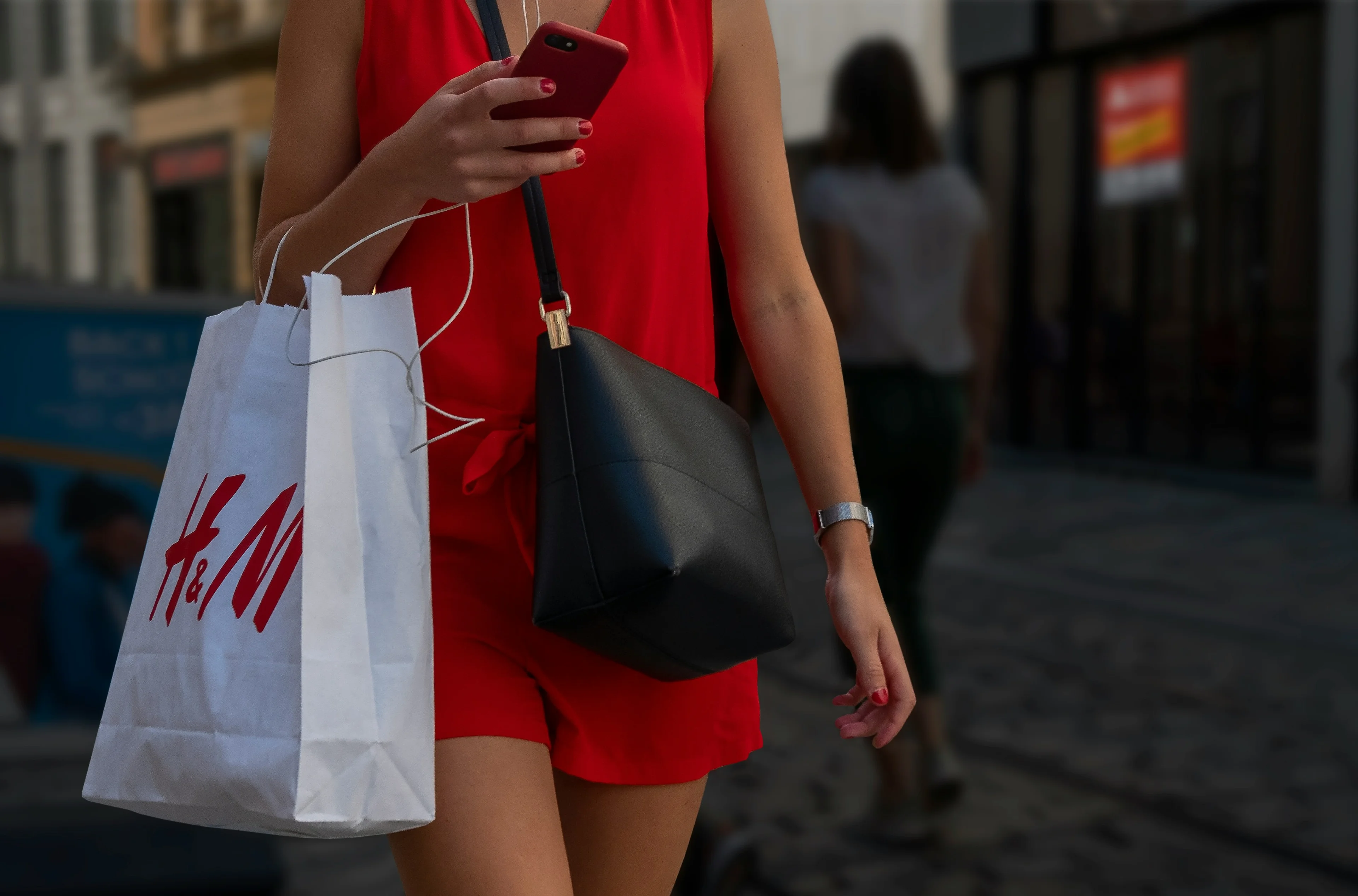 person shopping with h&m bag