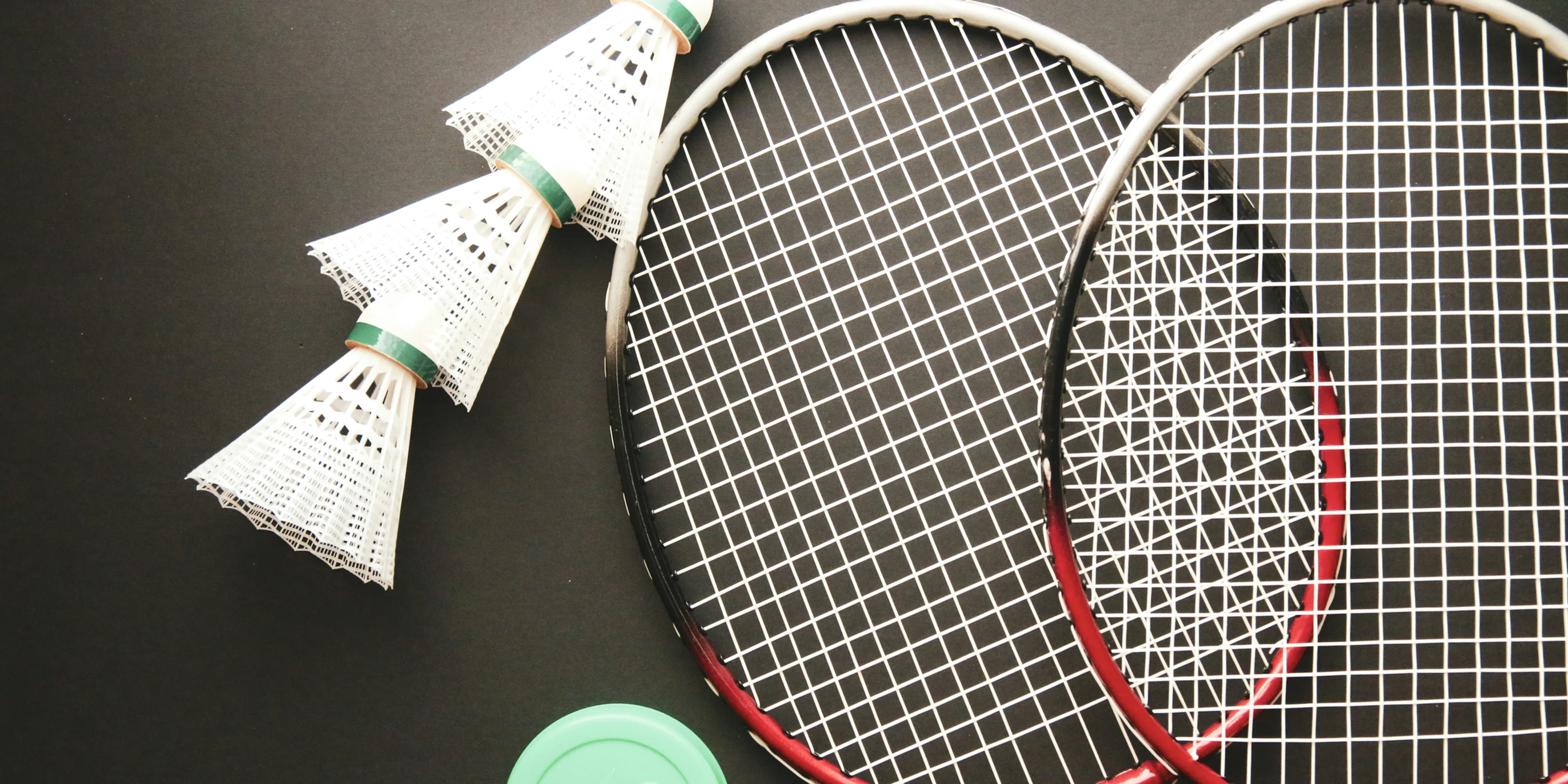 A couple of tennis racquets sitting on top of a table