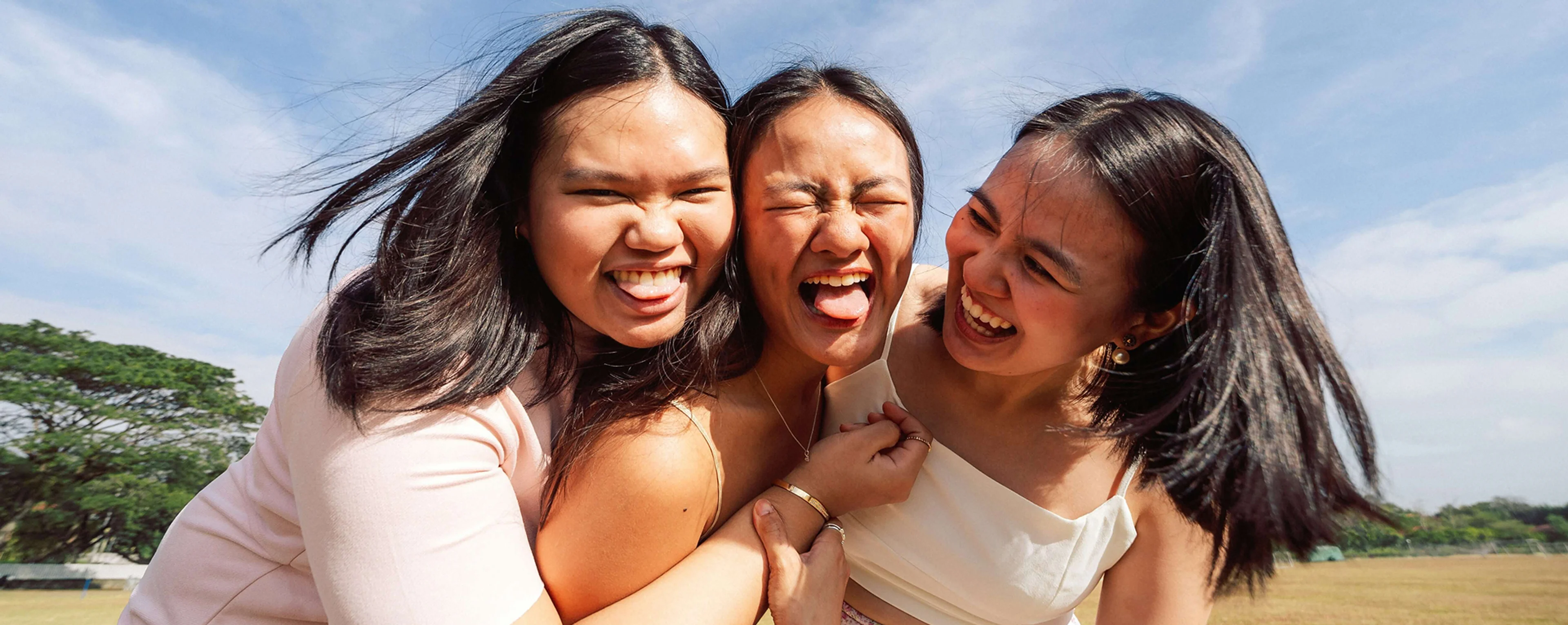 three women laughing